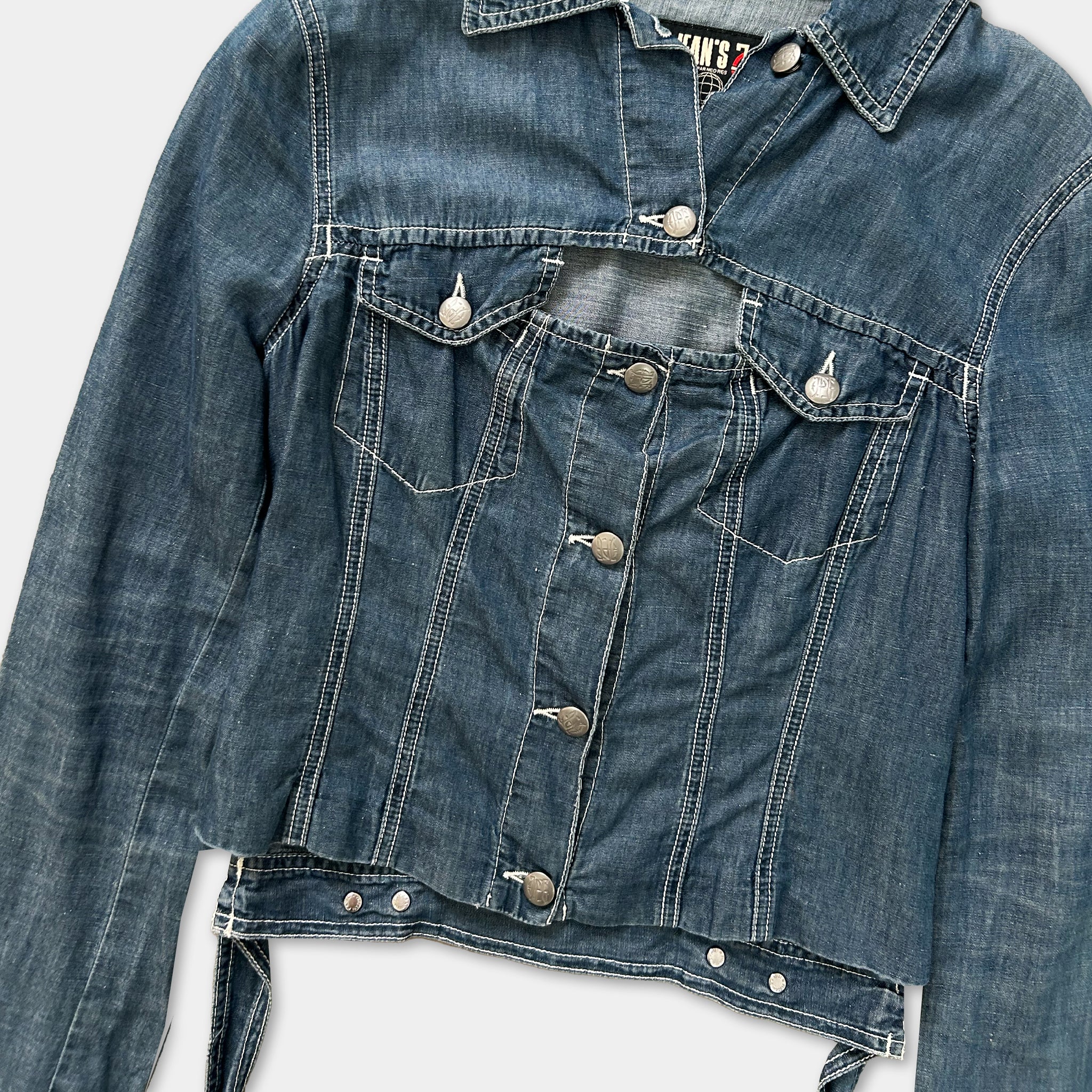 A denim jacket with a button-down front and a front pocket.