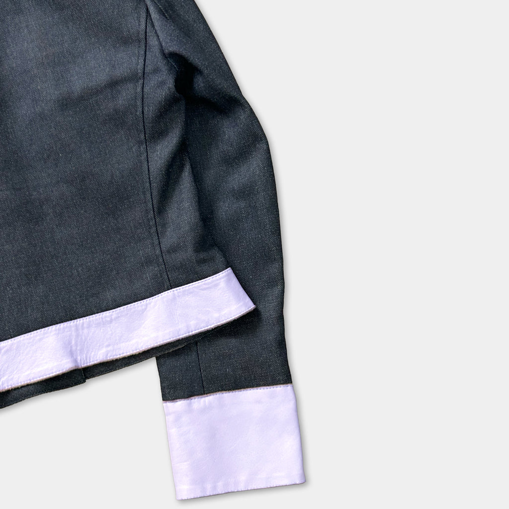 A dark grey jacket with a white trim, placed on a white background.