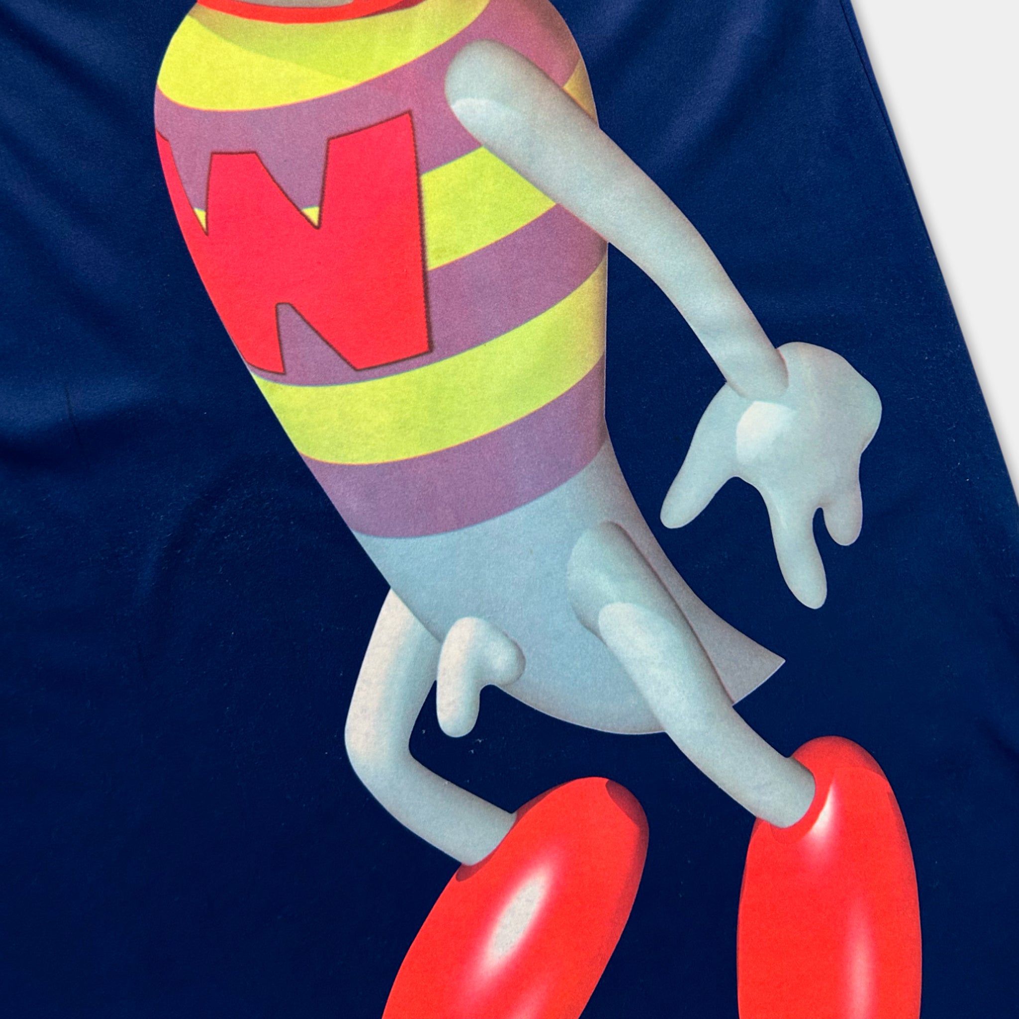 A colorful, cartoonish character with a large "W" on its chest, wearing a striped shirt and red shoes, is depicted in the image.