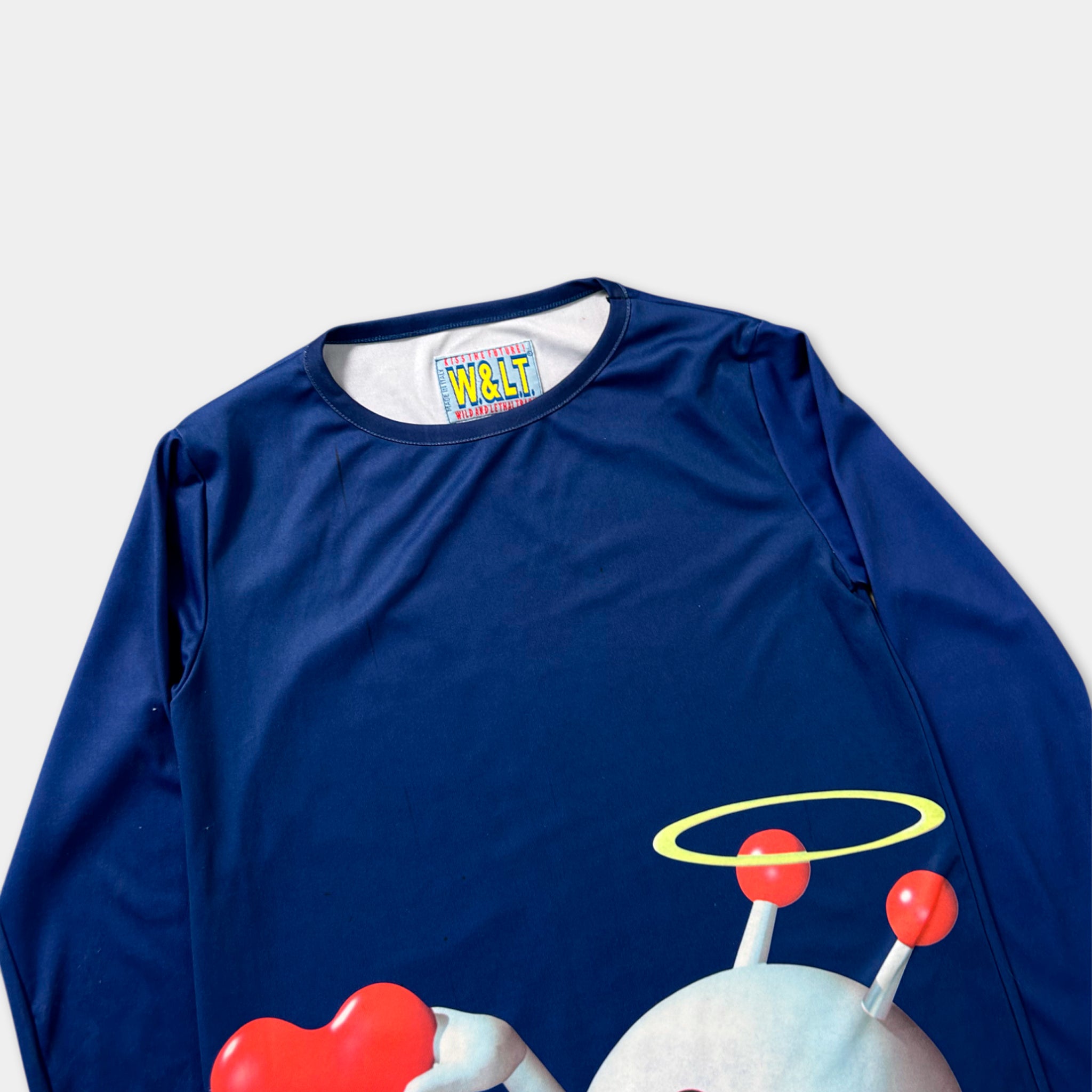 A blue long-sleeved shirt with a graphic design featuring a cartoon character and a halo.