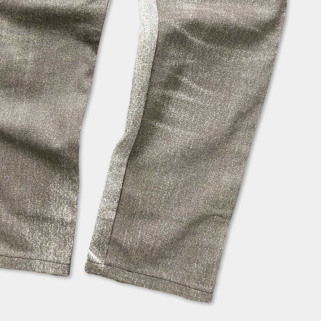 a pair of gray pants with a visible seam and zipper.