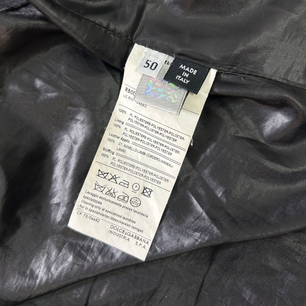 a close-up view of a fabric label attached to a garment, with a focus on the details and information provided on the label.