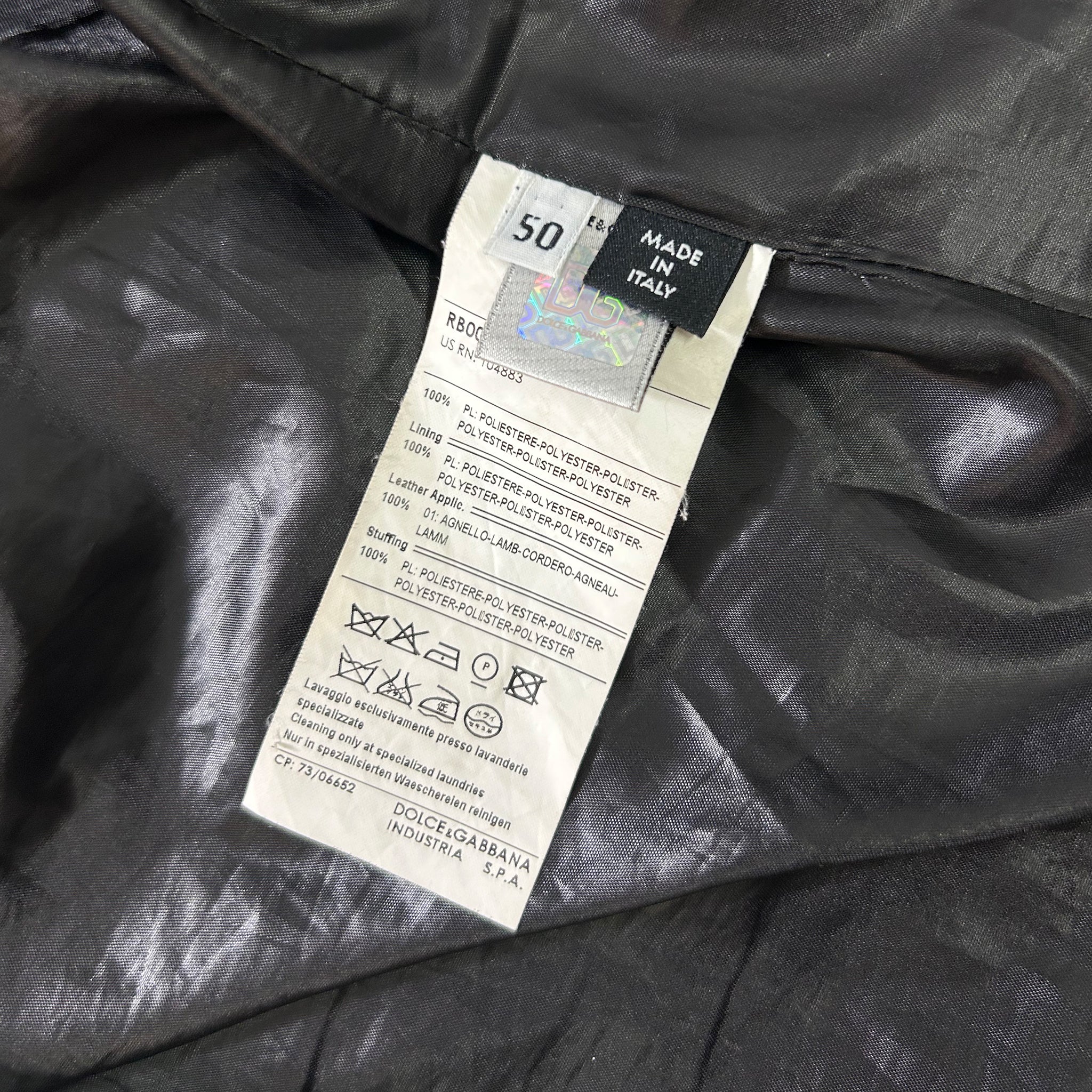 a close-up view of a fabric label attached to a garment, with a focus on the details and information provided on the label.
