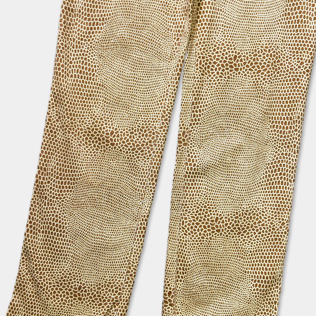 a pair of brown pants with a distinctive pattern of small circles or dots on the fabric.