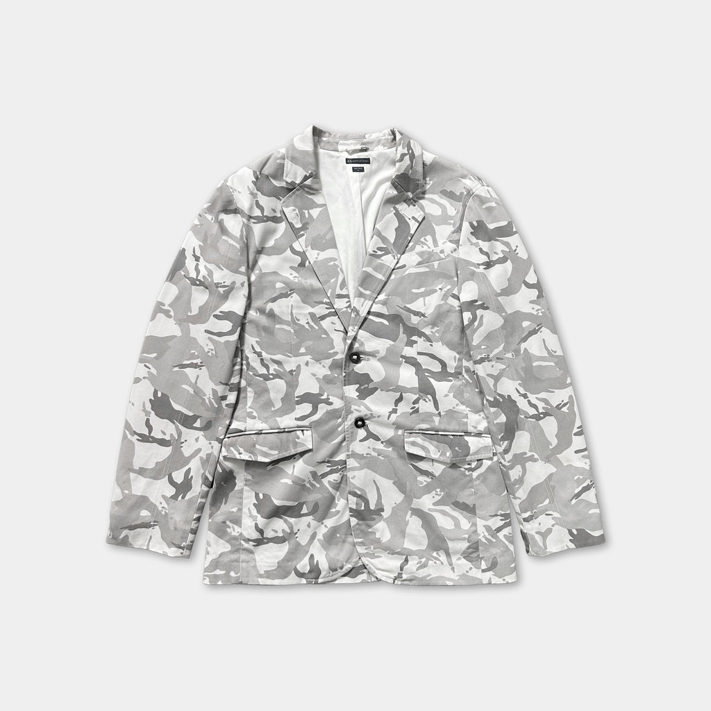 A gray and white camouflage patterned blazer jacket is displayed against a white background.