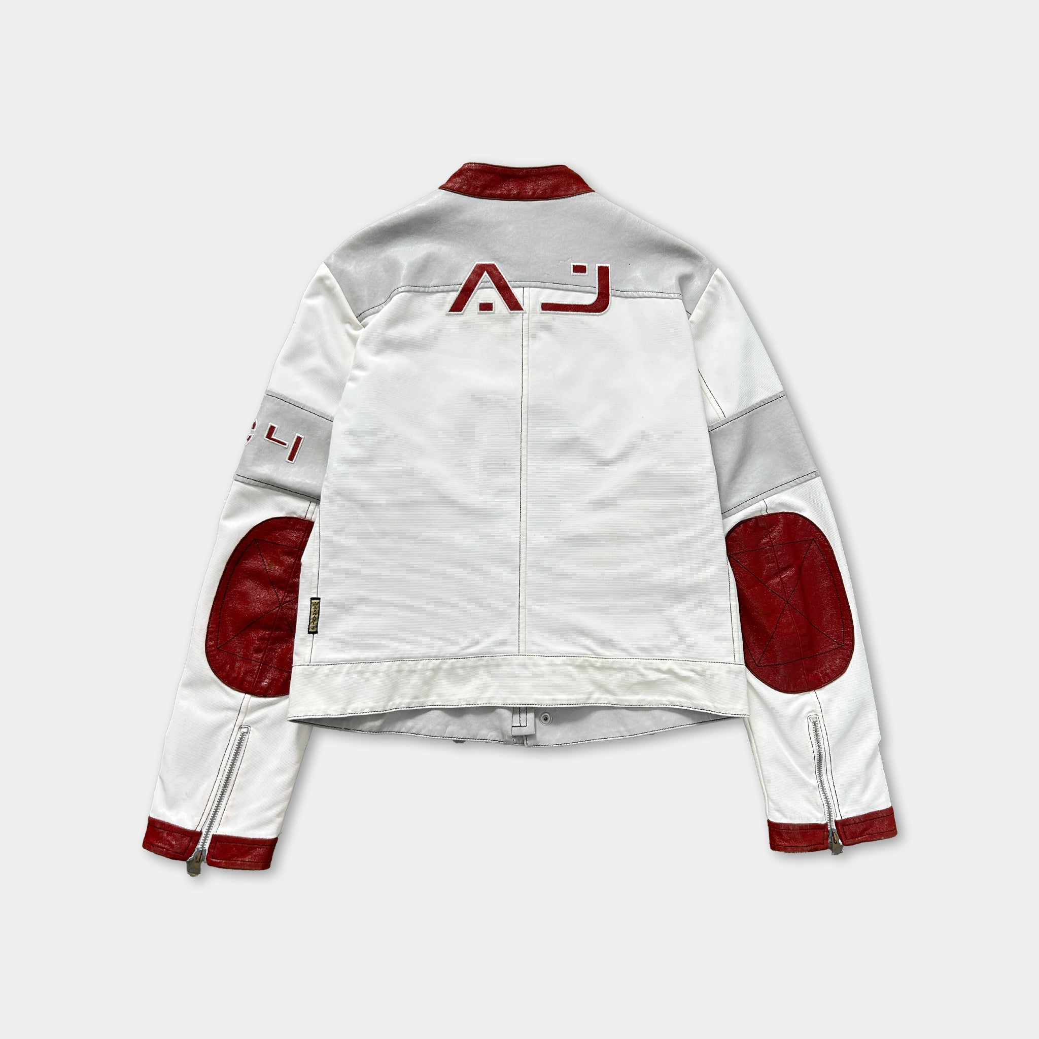 A white and red jacket with red patches on the sleeves and collar.