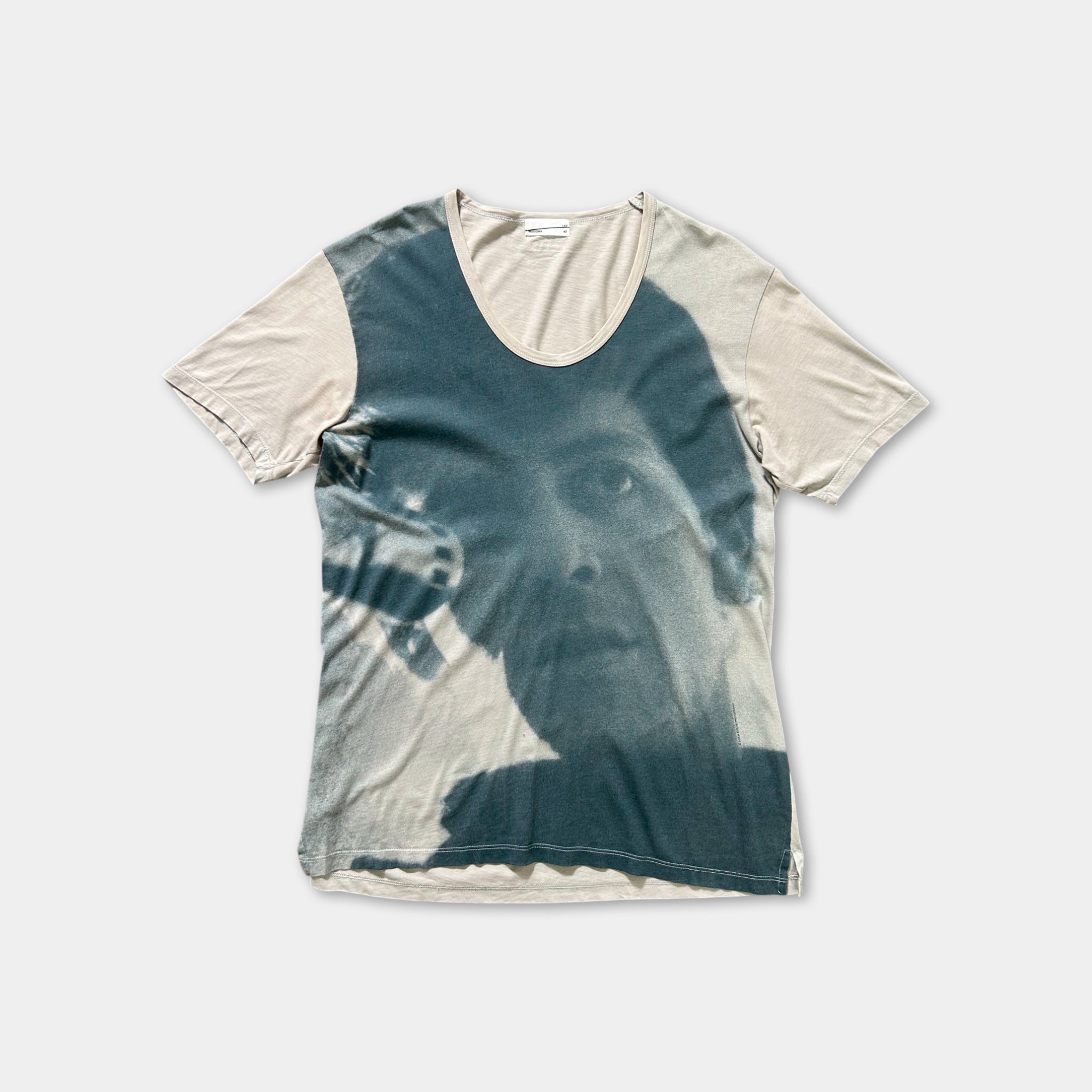 a t-shirt with a printed design of a person's face.