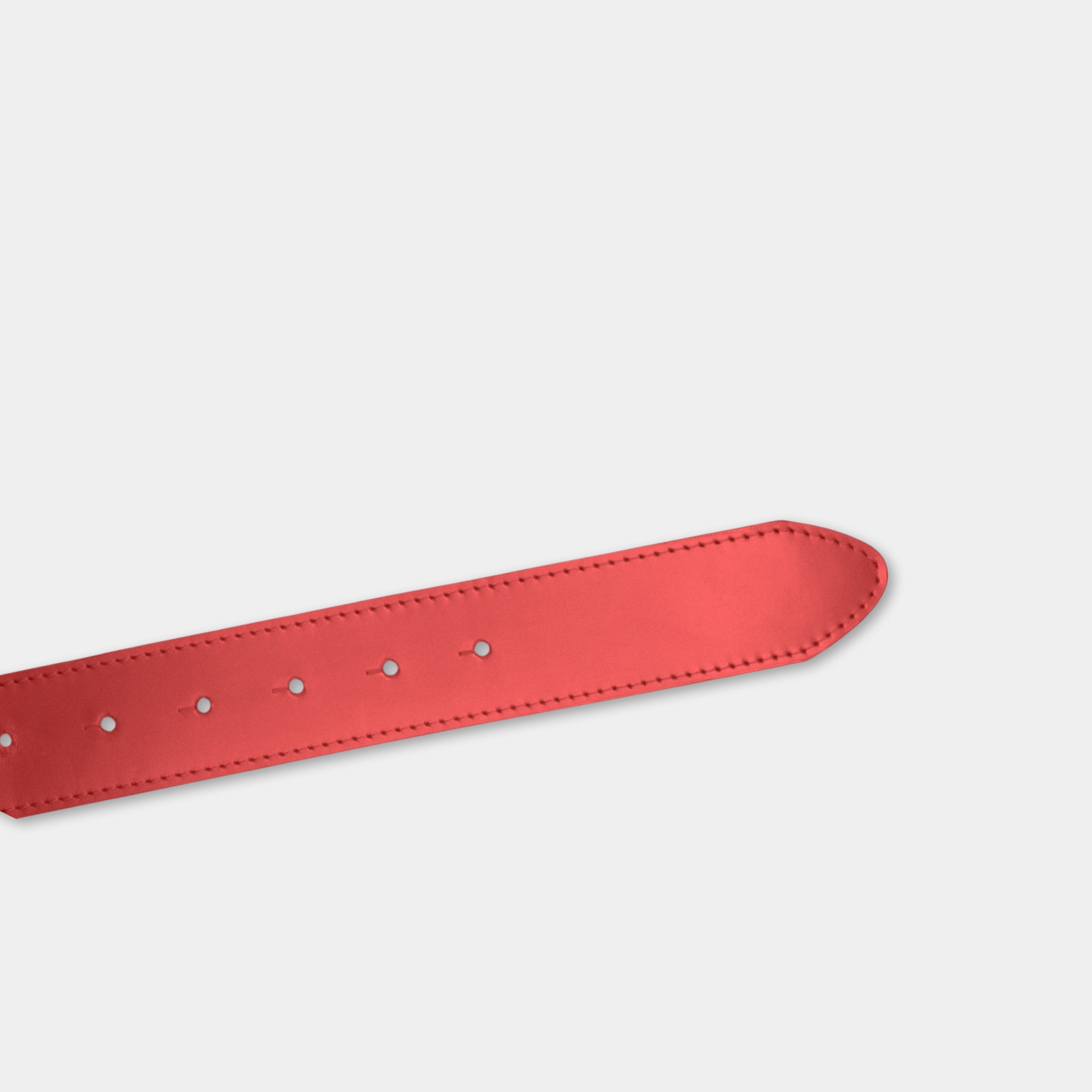 A red leather belt with a single buckle is shown against a plain white background.