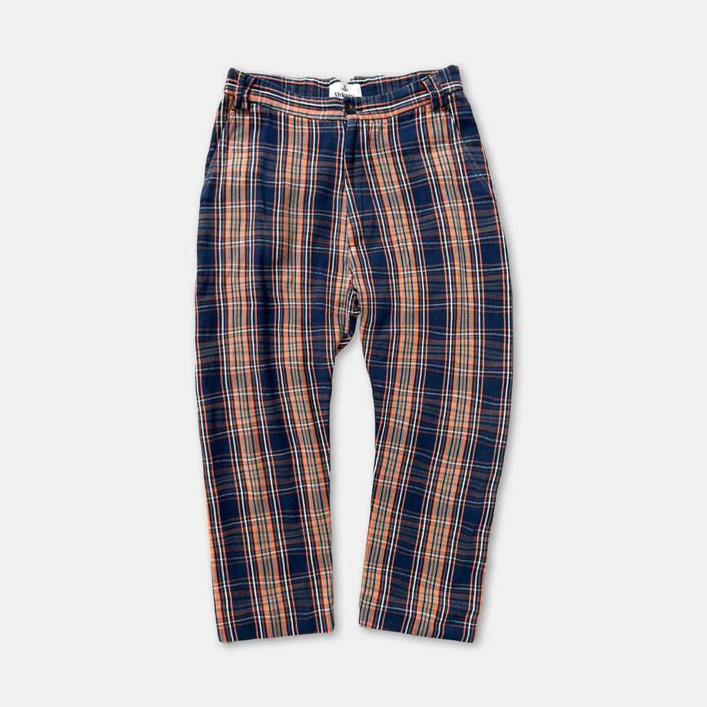 A pair of plaid pants with a distinctive pattern of orange and blue stripes.