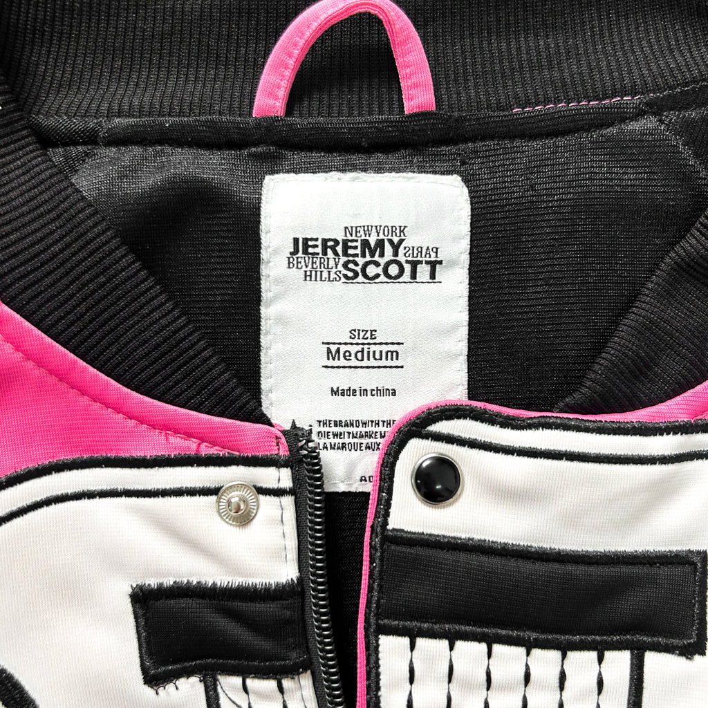 a close-up view of a jacket label, featuring the brand name and size information.