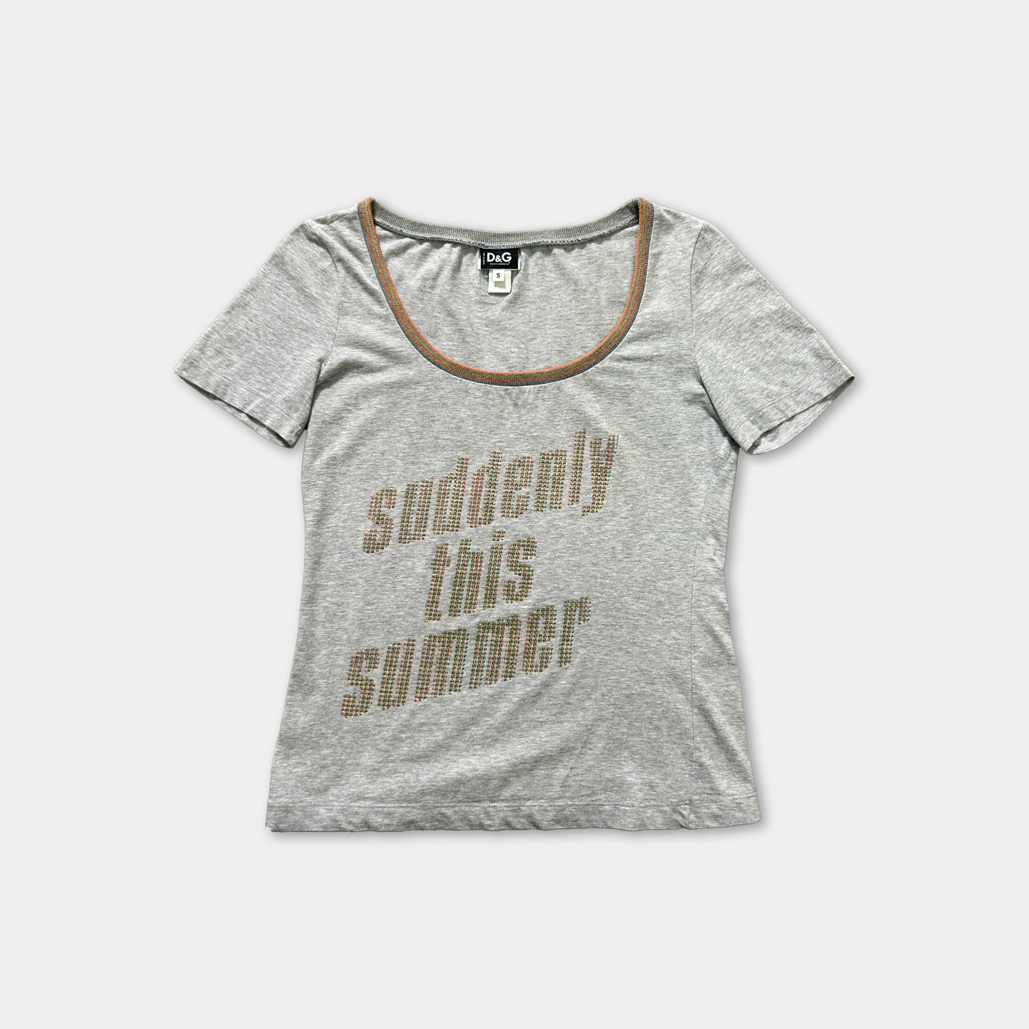 A gray t-shirt with the text "suddenly this summer" printed on it.