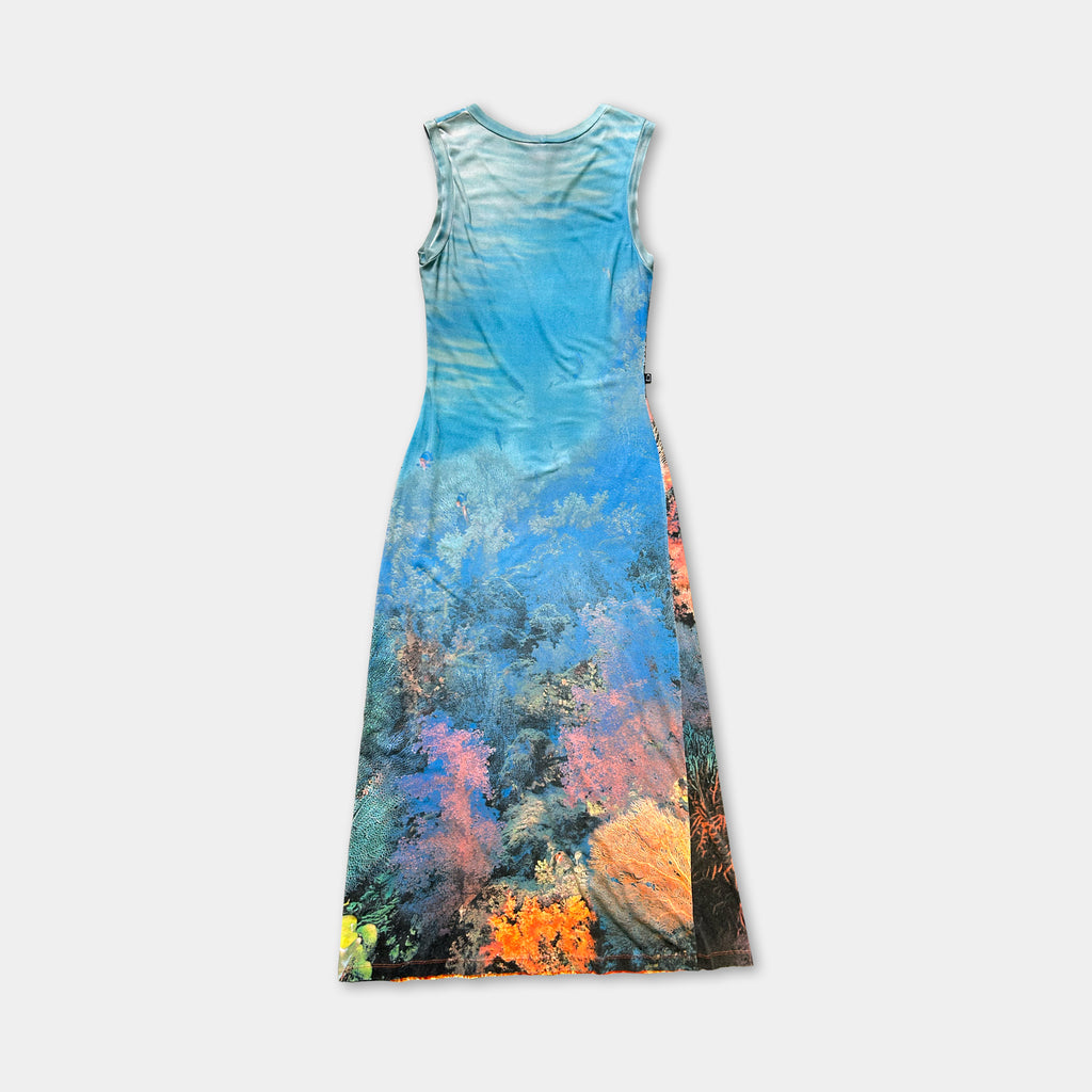 A sleeveless dress with a vibrant, colorful print depicting a tropical or underwater scene.