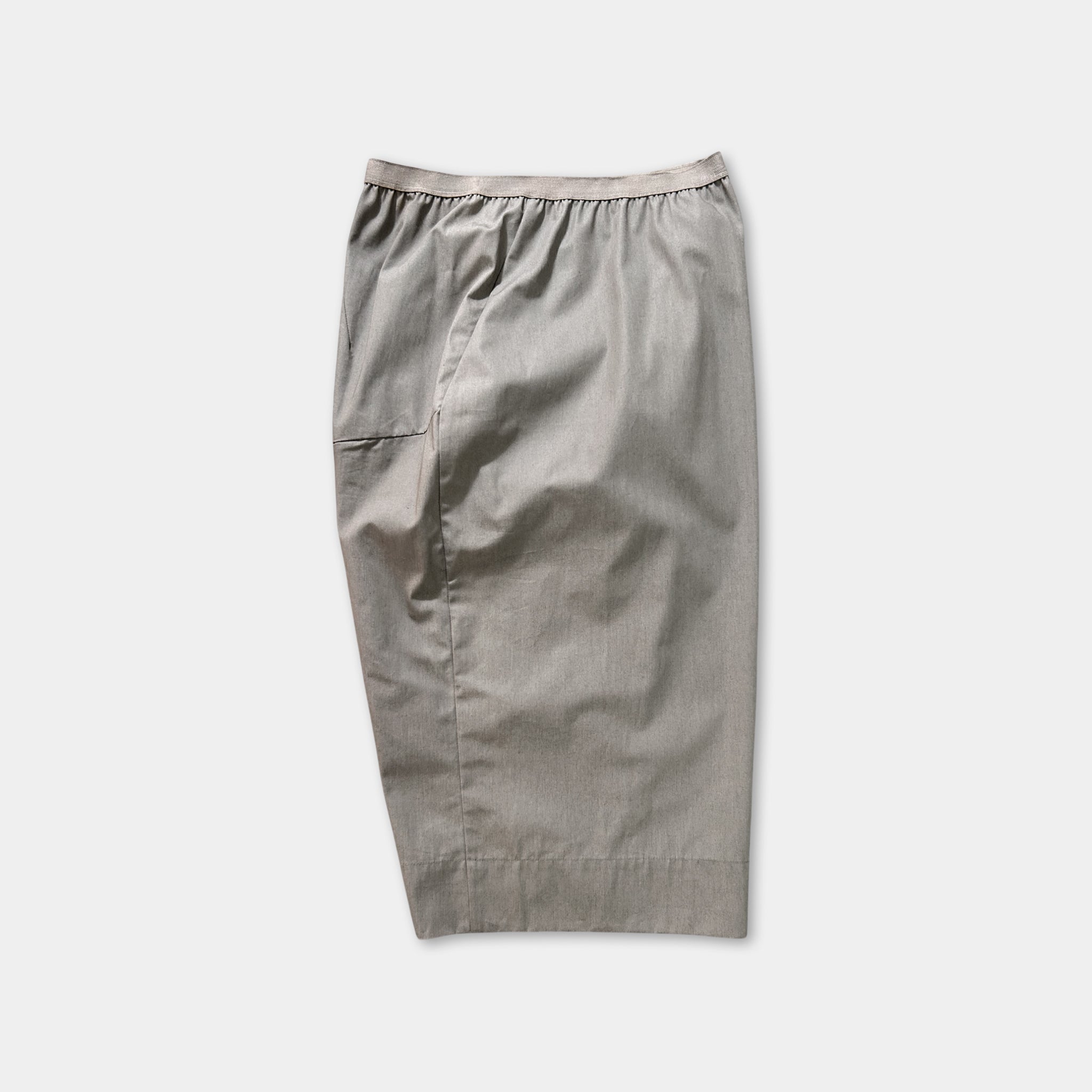 A pair of gray shorts with a ruffled waistband.