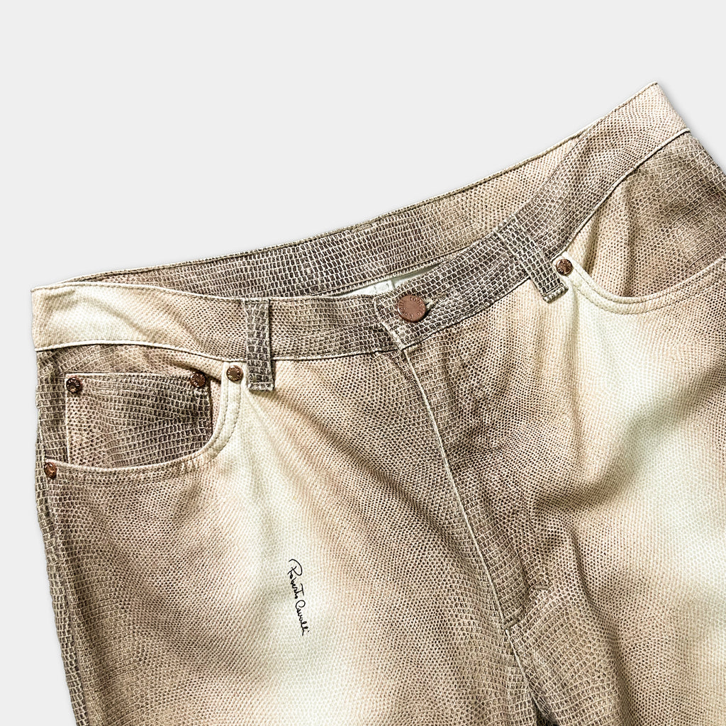 A pair of tan-colored jeans with a distinctive pattern, displayed on a plain background.