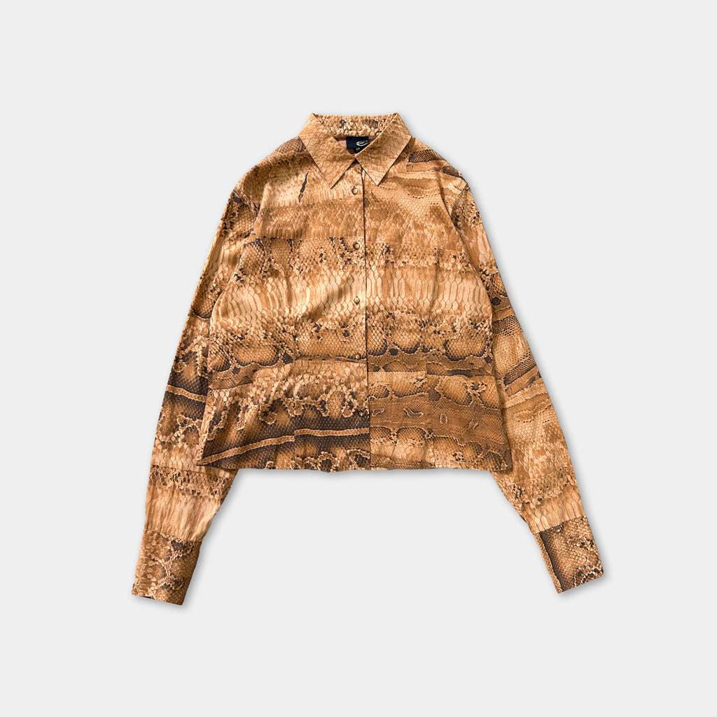 a long-sleeved shirt with a patterned design, displayed against a plain background.
