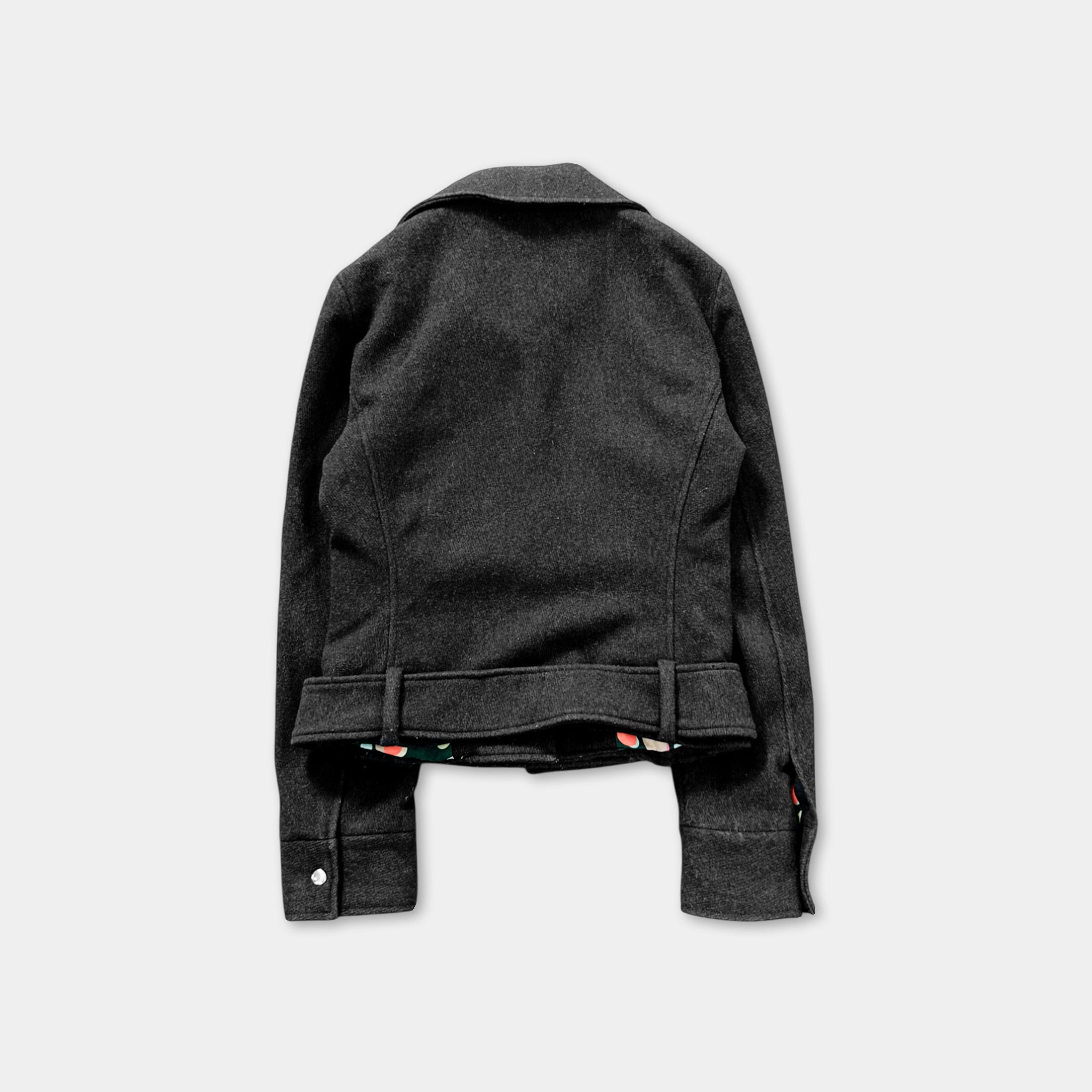 the back view of a black jacket with a collar and a floral pattern on the inside lining.