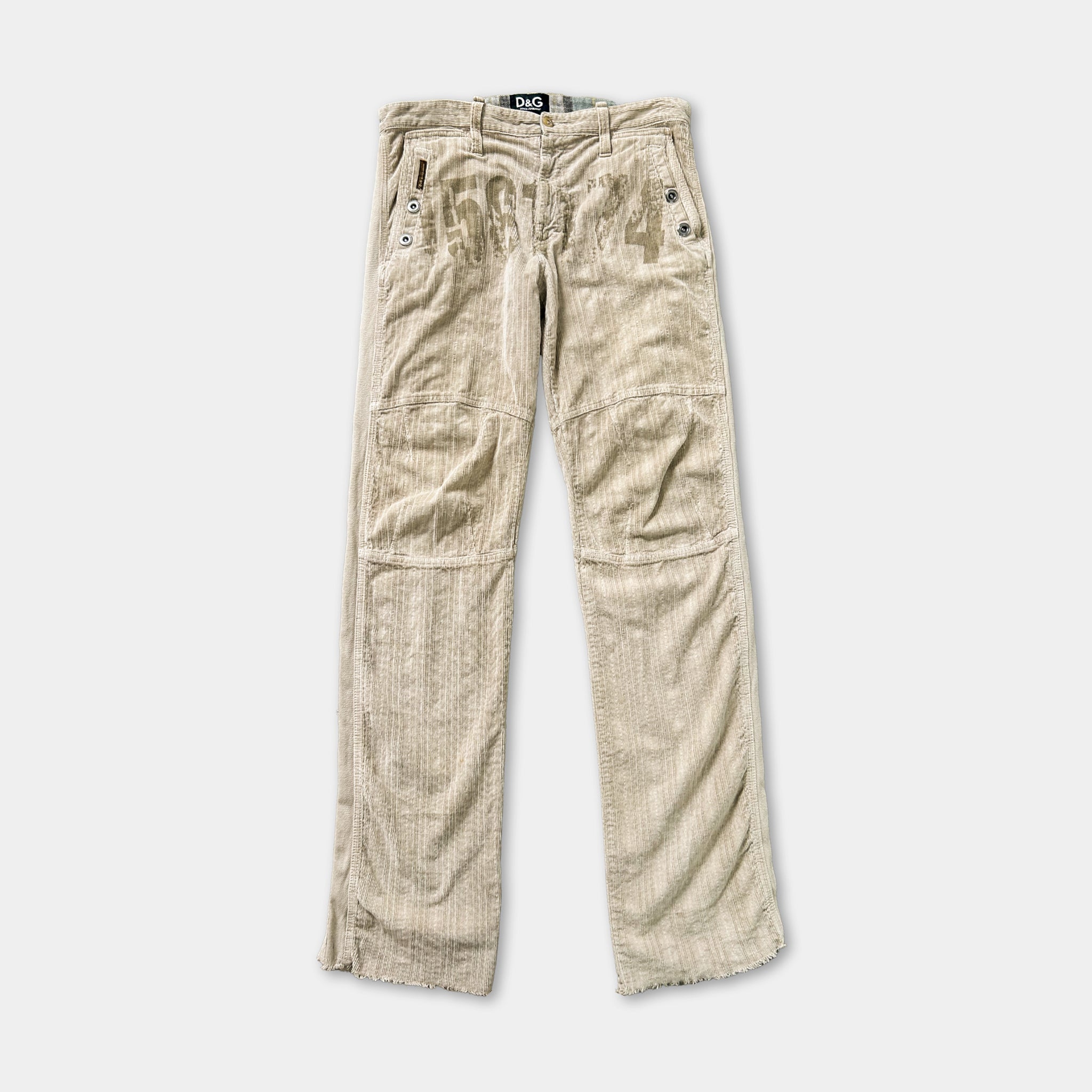 A pair of beige corduroy pants with a zipper and pockets.