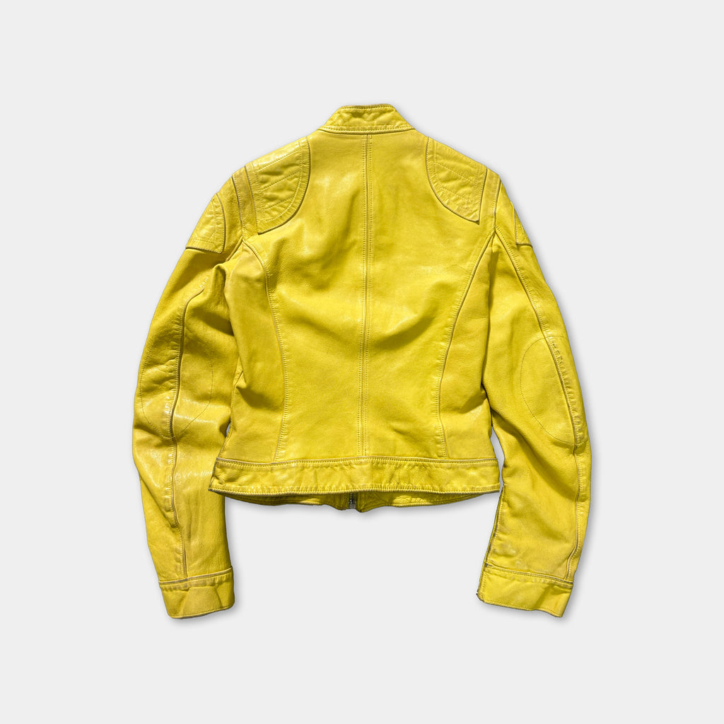 A yellow leather jacket is displayed against a white background.