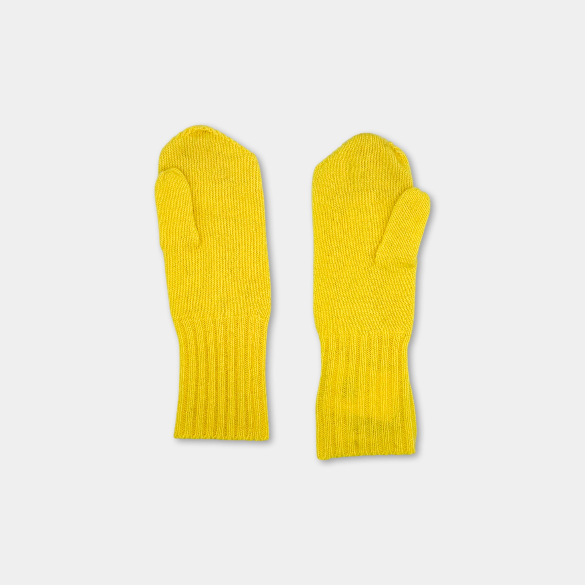 A pair of yellow knitted mittens against a white background.