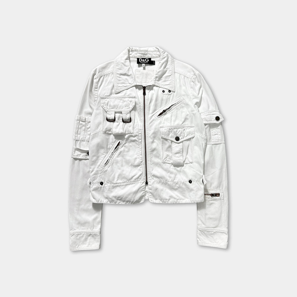A white jacket with multiple pockets and zippers, displayed against a plain background.