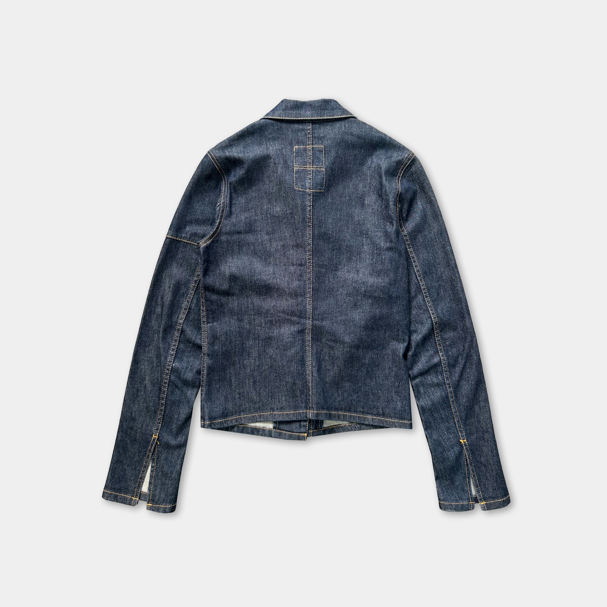 A denim jacket with long sleeves and a button-down front, displayed against a plain background.