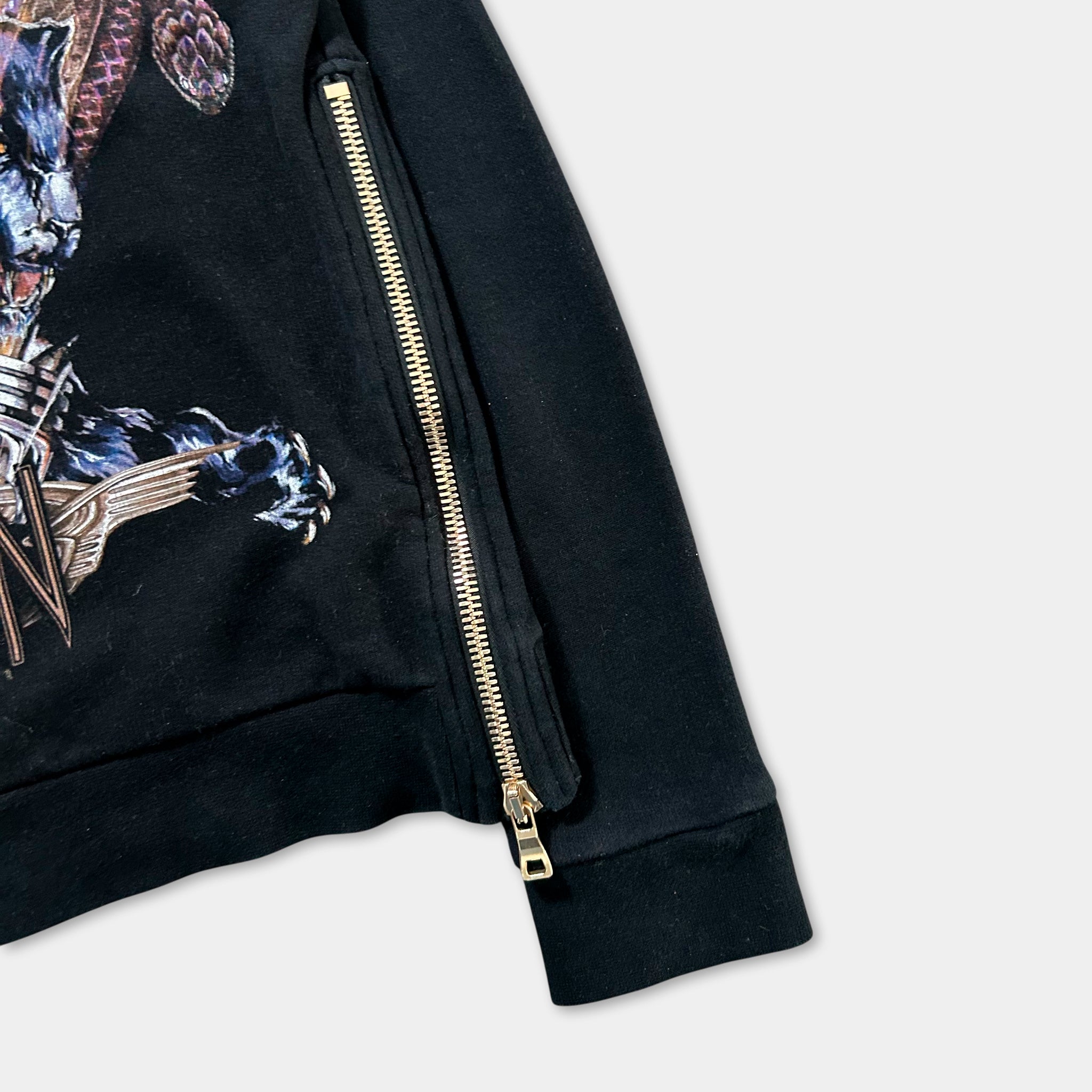 a close-up view of a black zip-up jacket with a zipper running down the front.