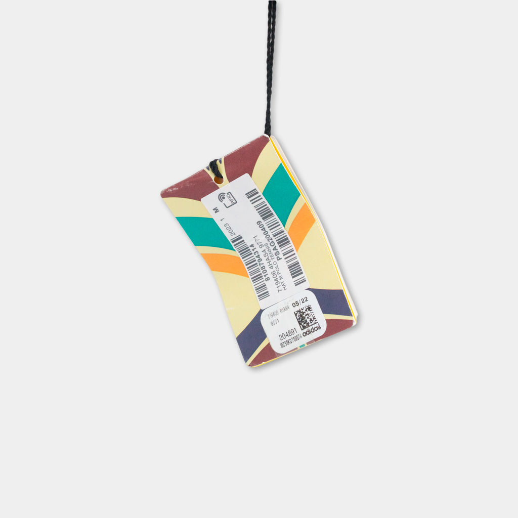 a colorful, abstract-patterned tag hanging from a string.