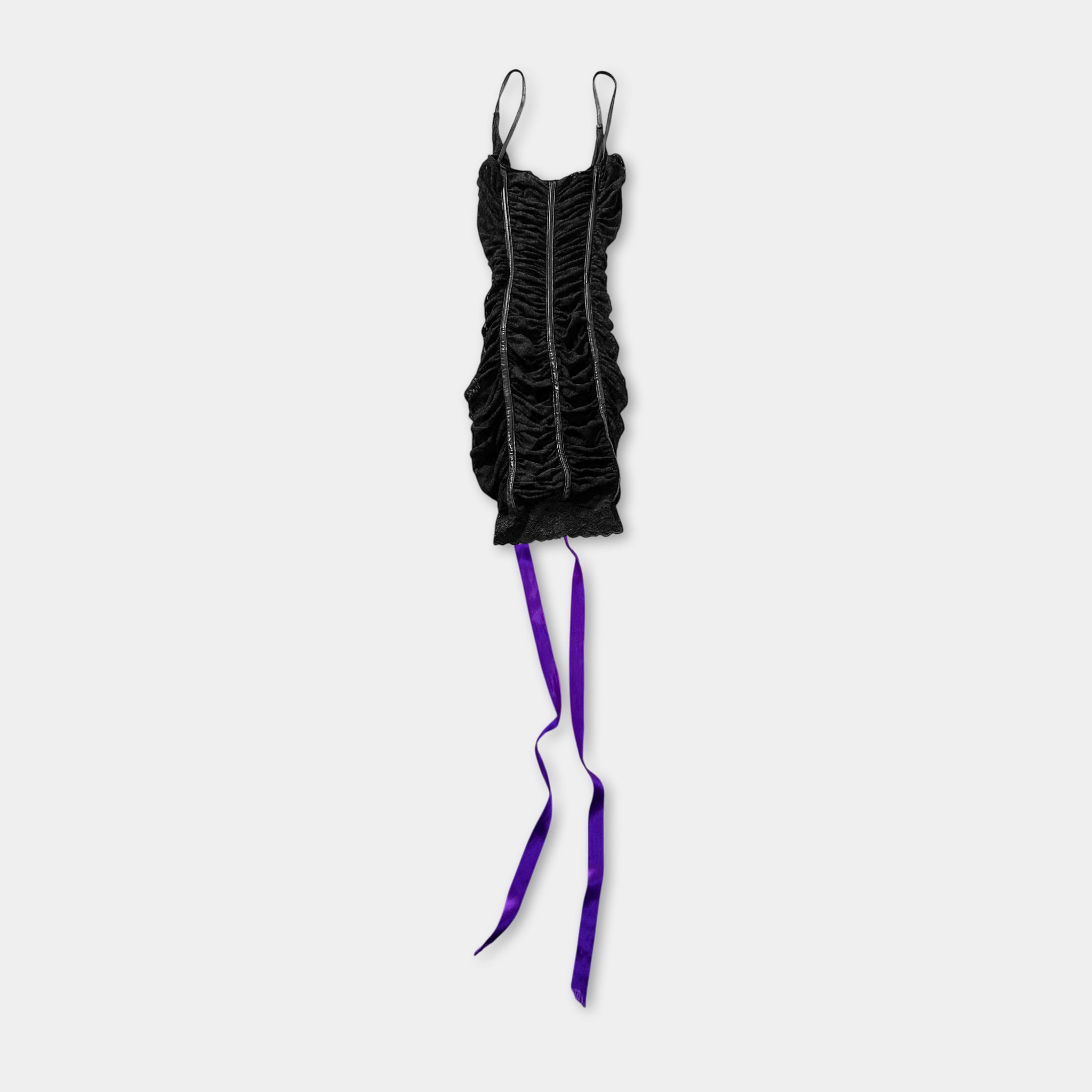 A black dress with ruched bodice and purple ribbons hanging from the bottom.