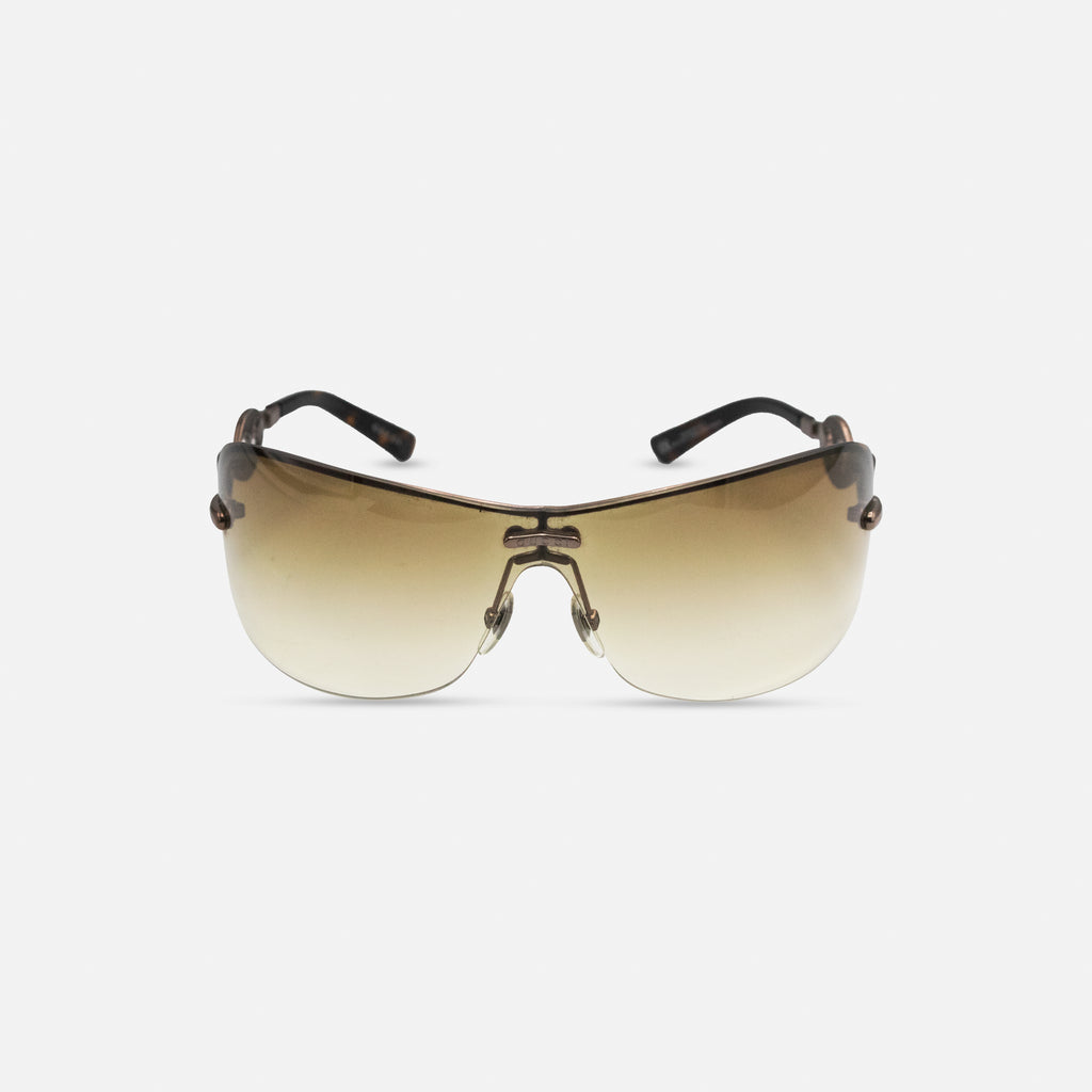 A pair of brown sunglasses with a tortoiseshell frame, displayed against a white background.