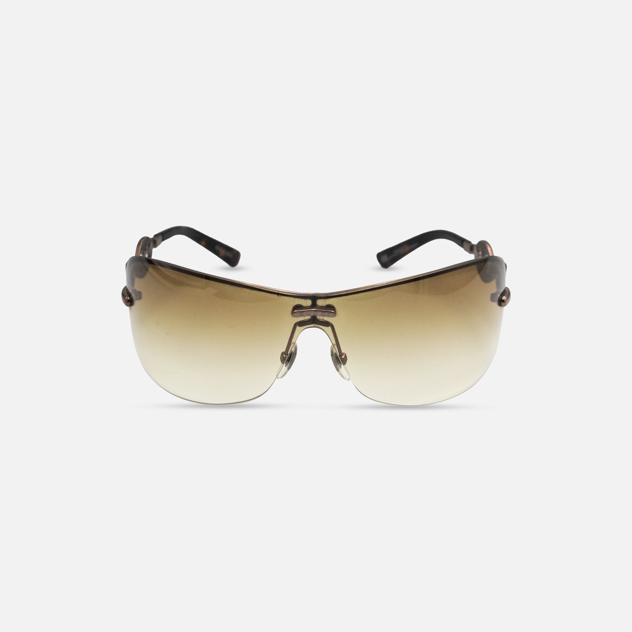 A pair of brown sunglasses with a tortoiseshell frame, displayed against a white background.