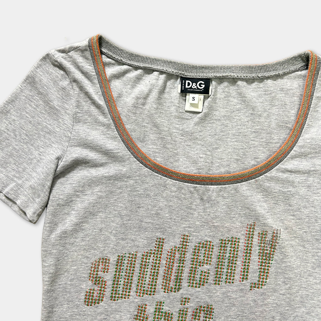 A gray t-shirt with a printed text design on the front.