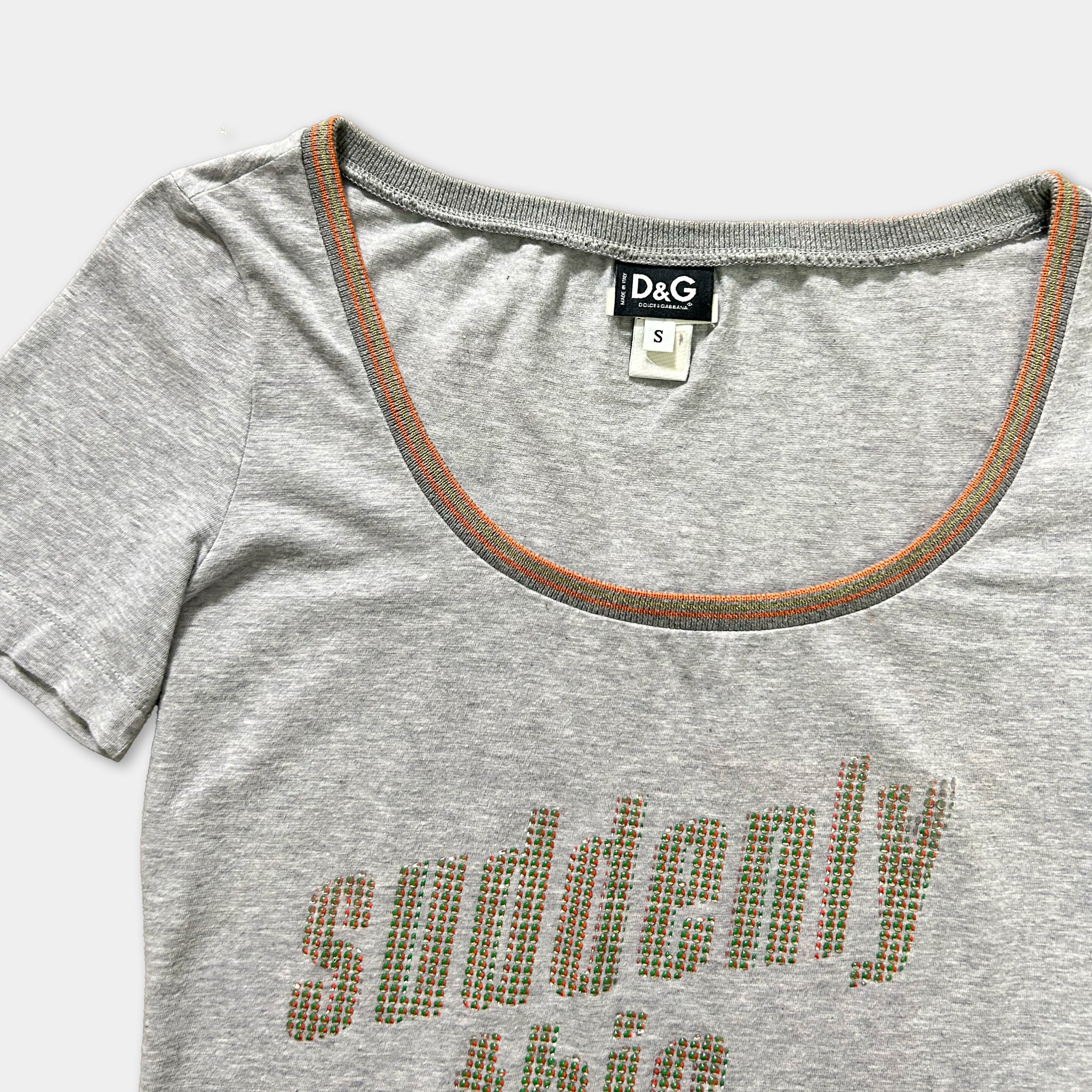 A gray t-shirt with a printed text design on the front.