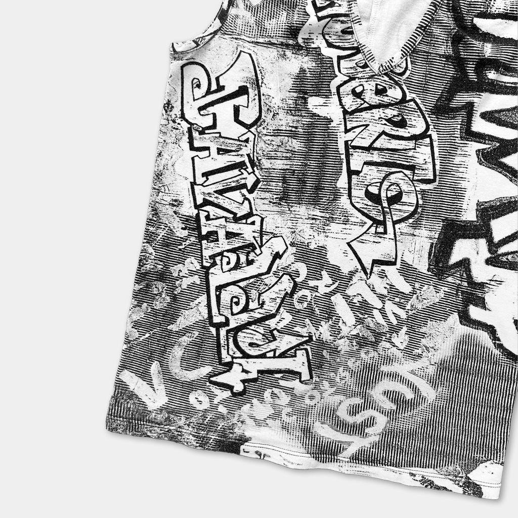 a close-up view of a black and white graphic design on a fabric, with various stylized text and patterns.