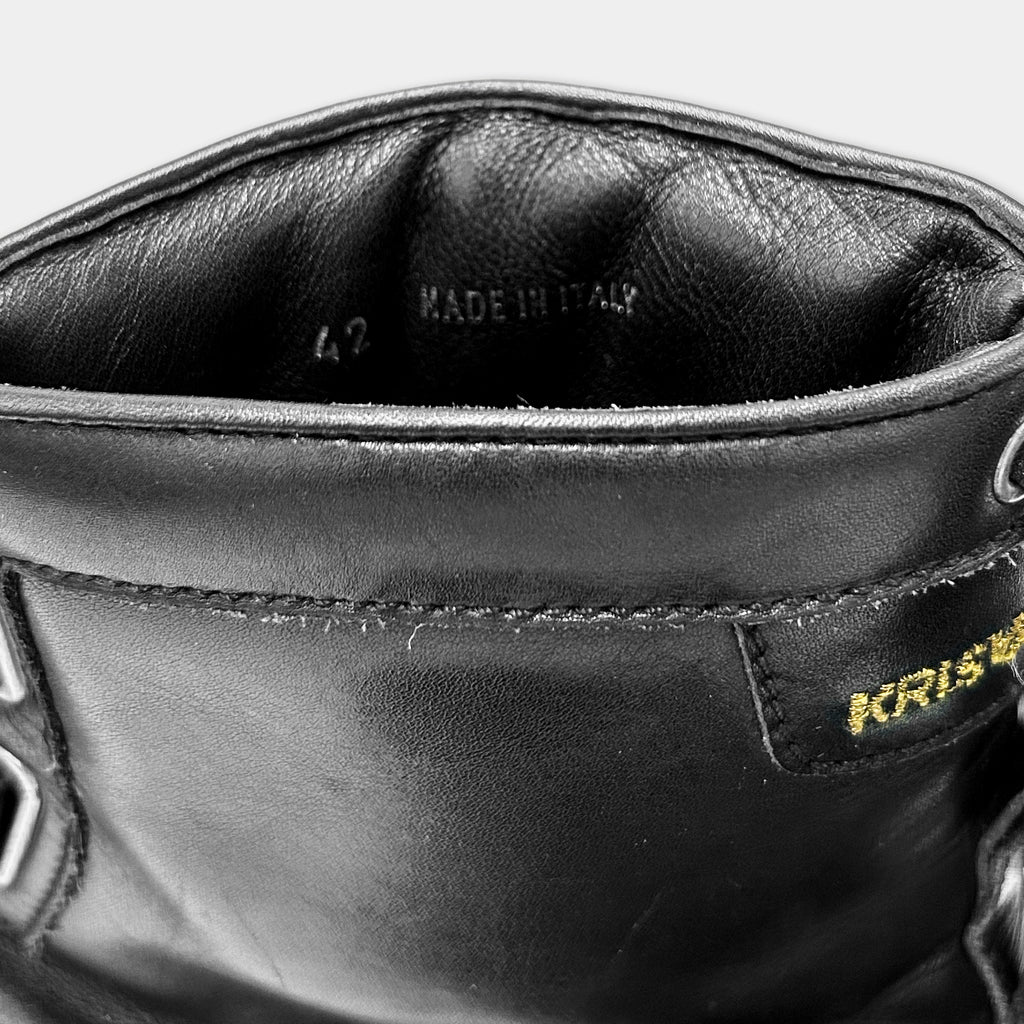 A close-up view of the interior of a black leather boot, showing the brand name "KRISKELL" printed on the side.