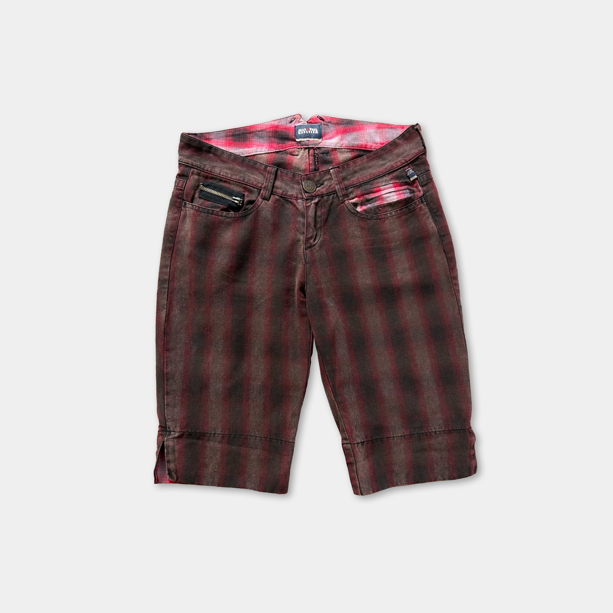 A pair of dark red plaid shorts with a zipper pocket on the front.