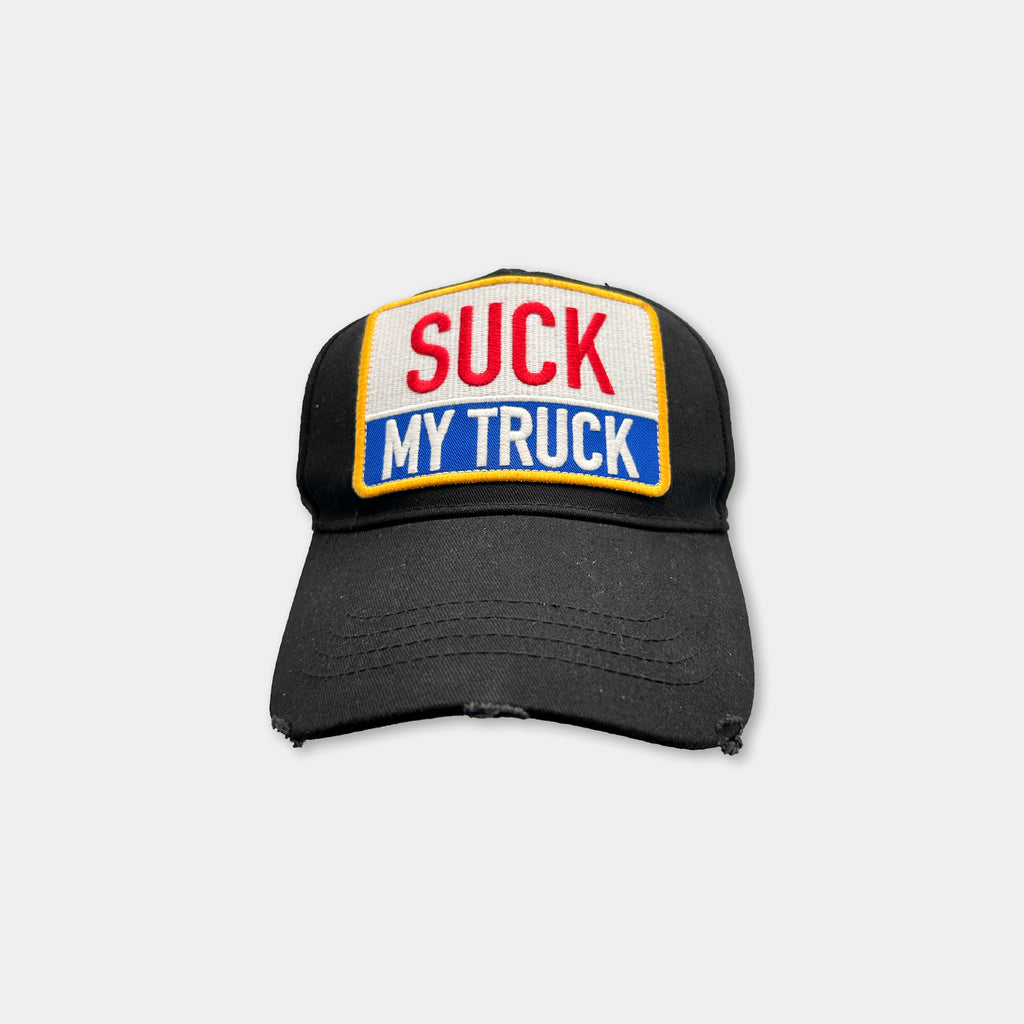 A black baseball cap with a patch on the front that says "SUCK MY TRUCK".