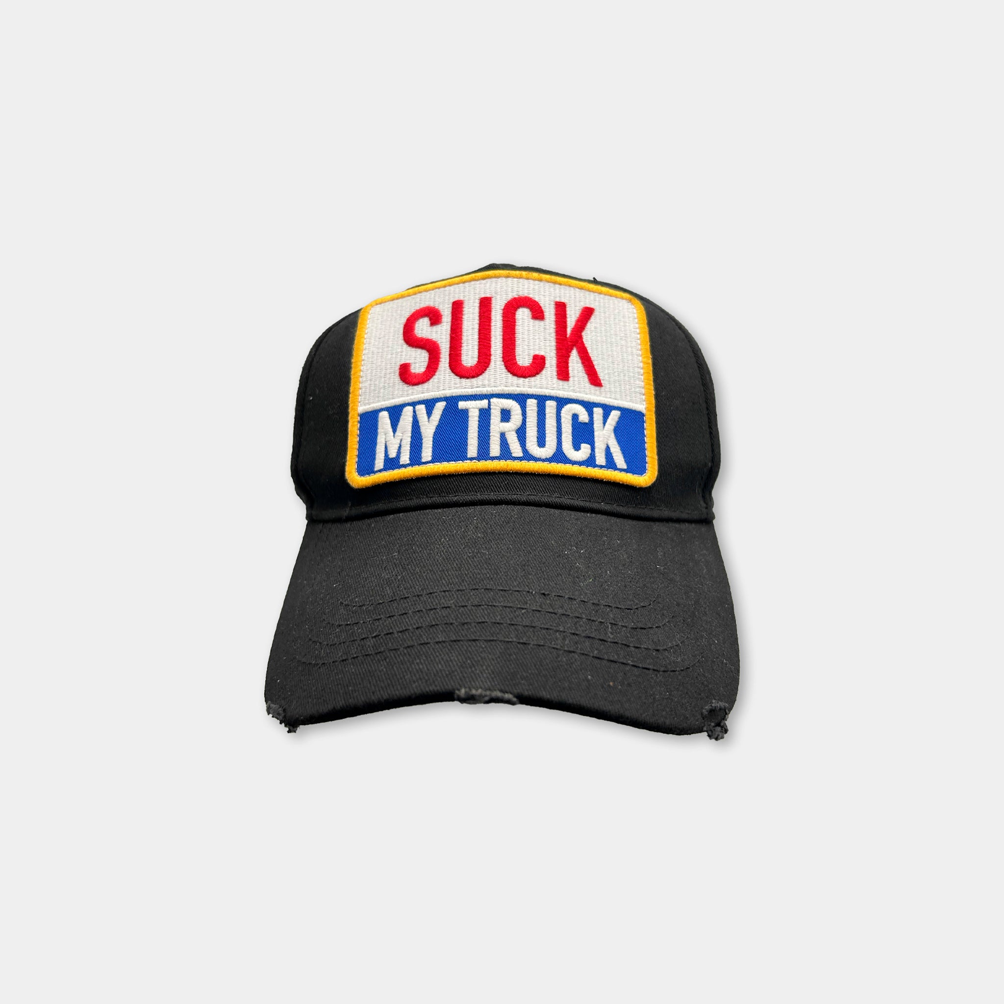 A black baseball cap with a patch on the front that says "SUCK MY TRUCK".