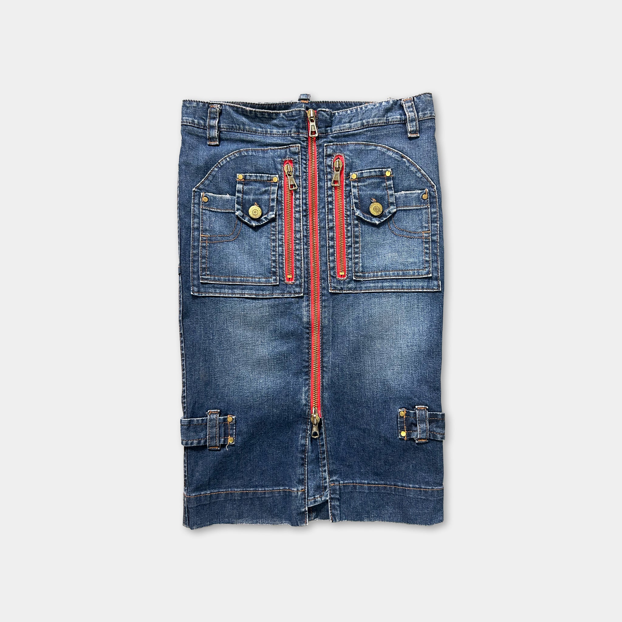 A pair of blue denim jeans with red zippers and pockets.