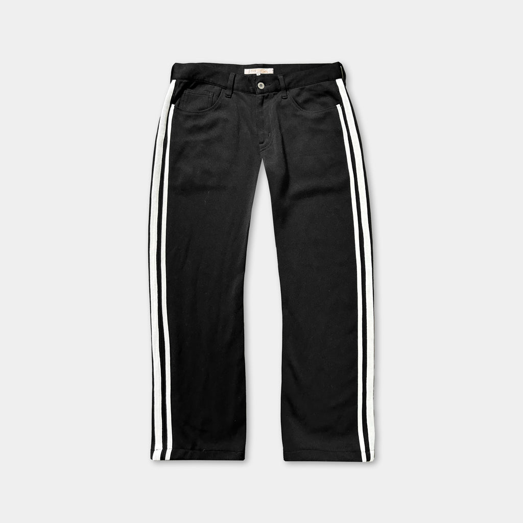 A pair of black pants with white stripes on the sides.
