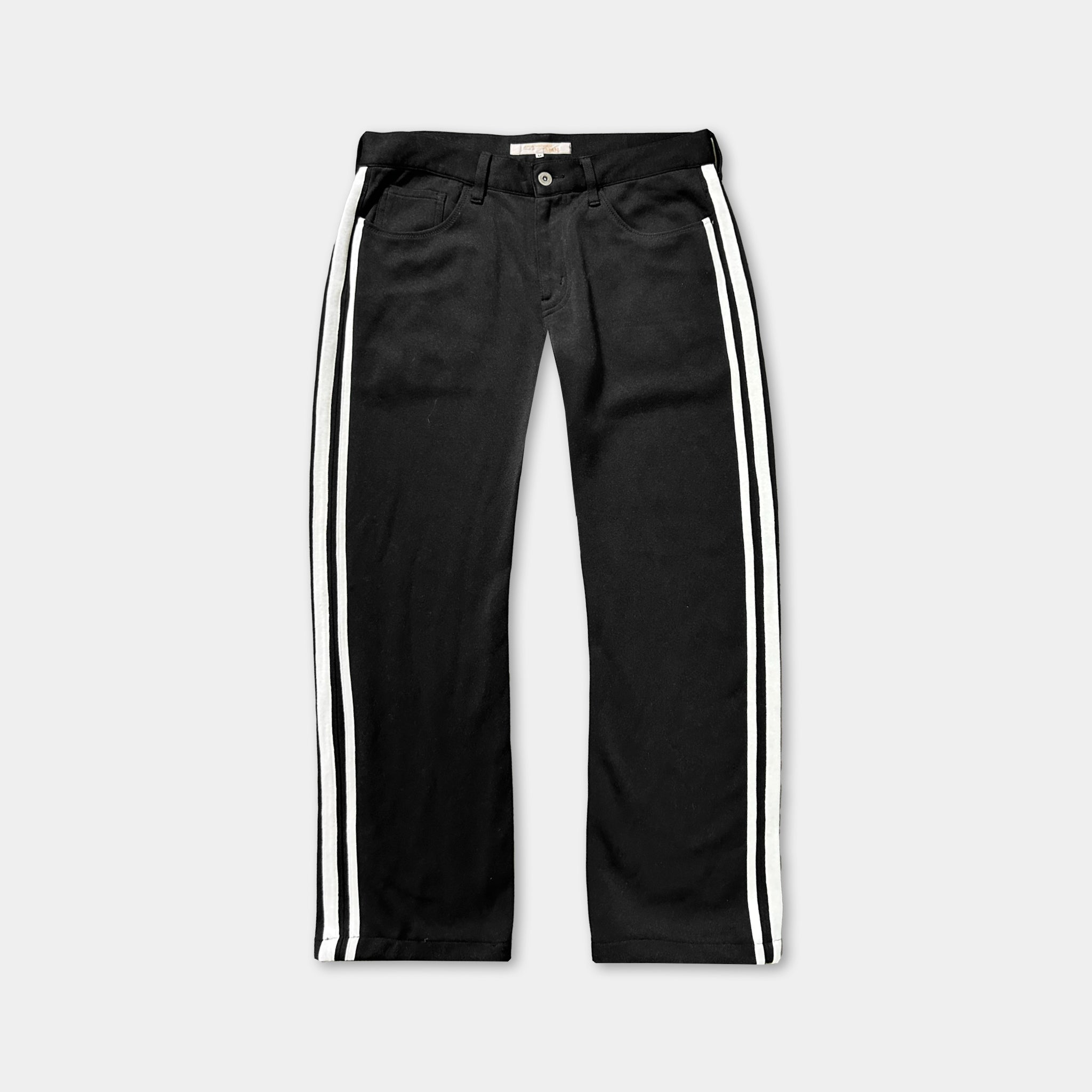 A pair of black pants with white stripes on the sides.