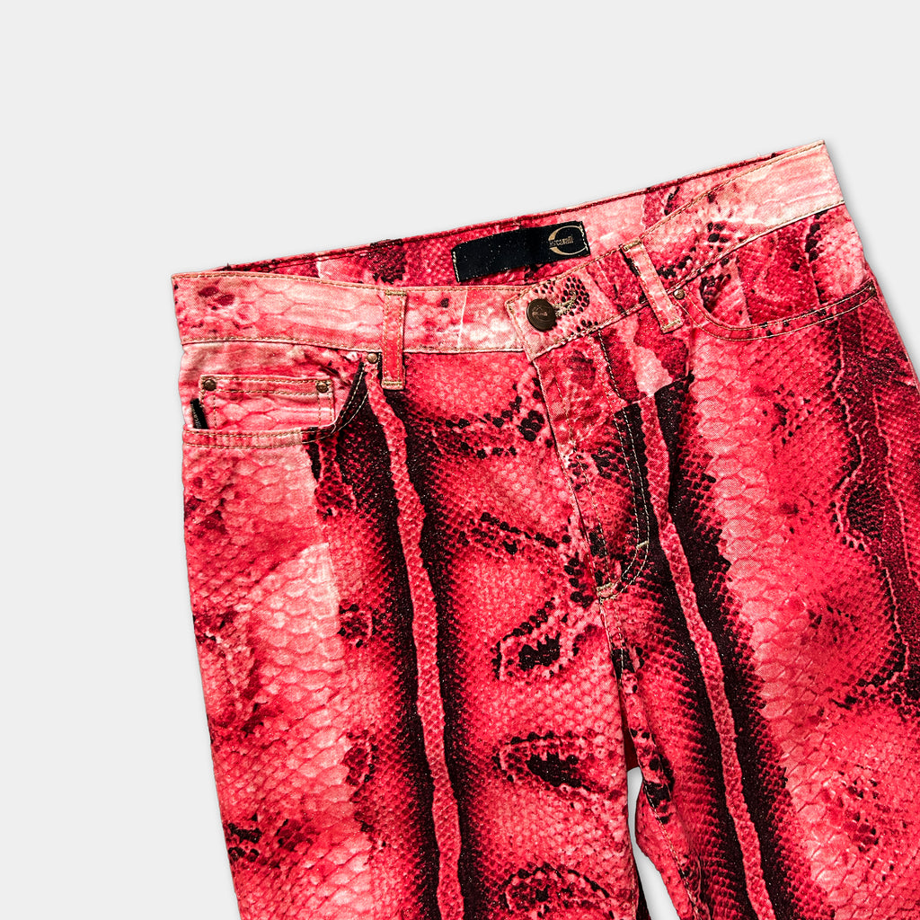 A pair of red, snake-print jeans with a distinctive pattern.