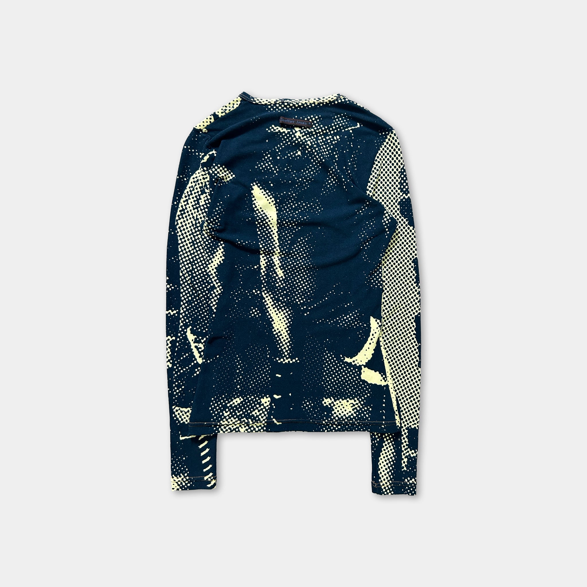 a long-sleeved shirt with a unique, abstract pattern in shades of blue and yellow.