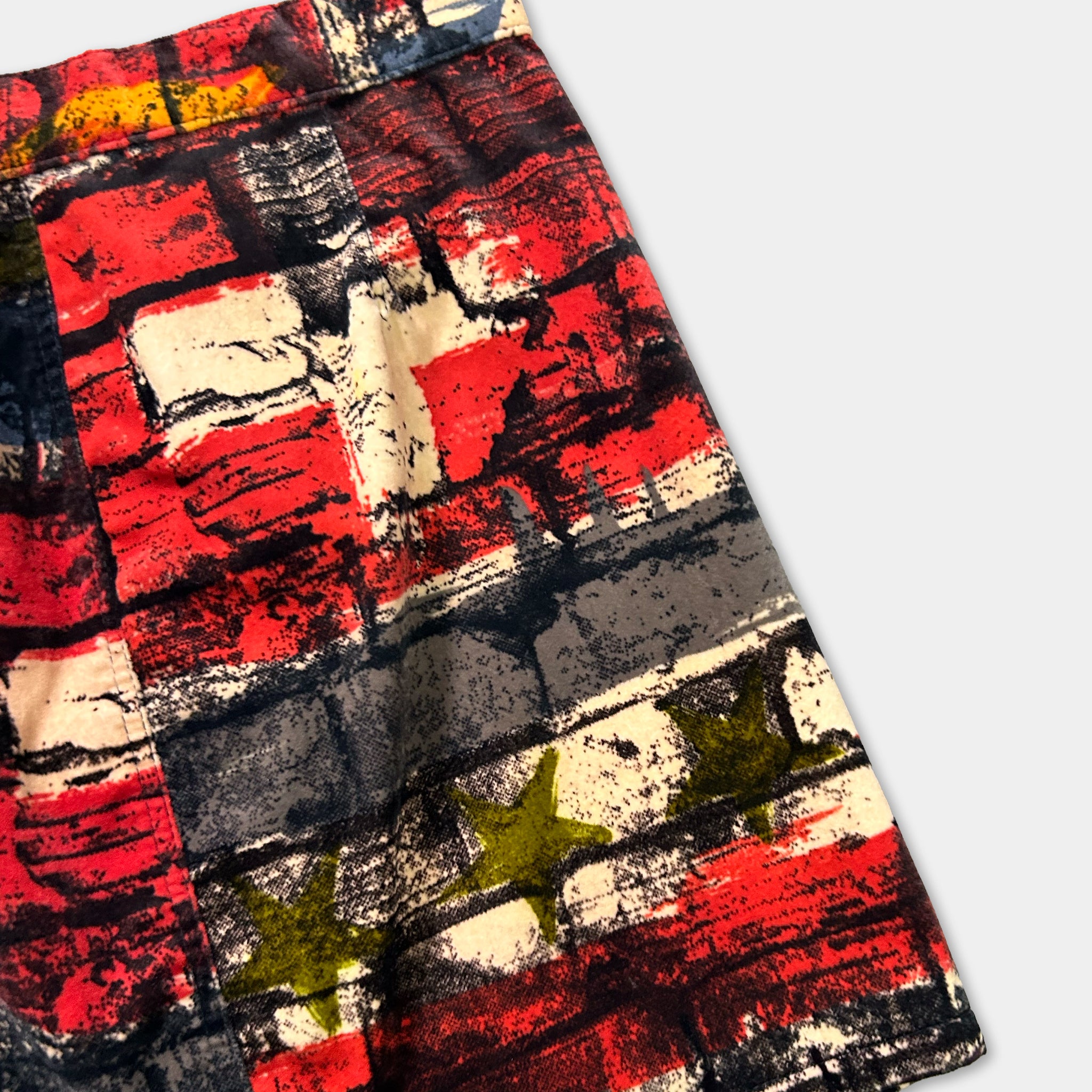 a vibrant, abstract pattern with bold colors and brushstrokes, creating a dynamic and eye-catching design.