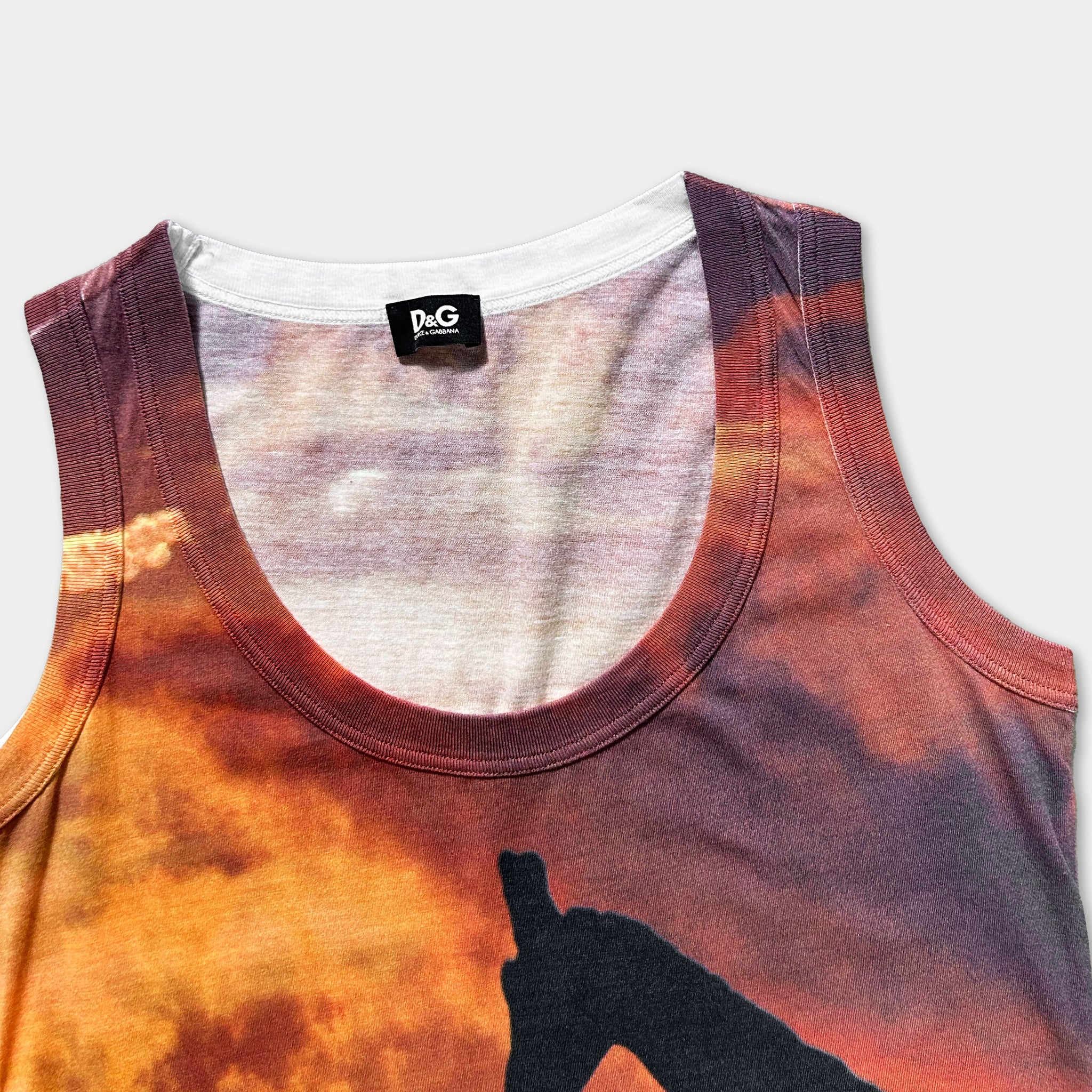 a close-up view of a colorful tank top with a printed design on the front.