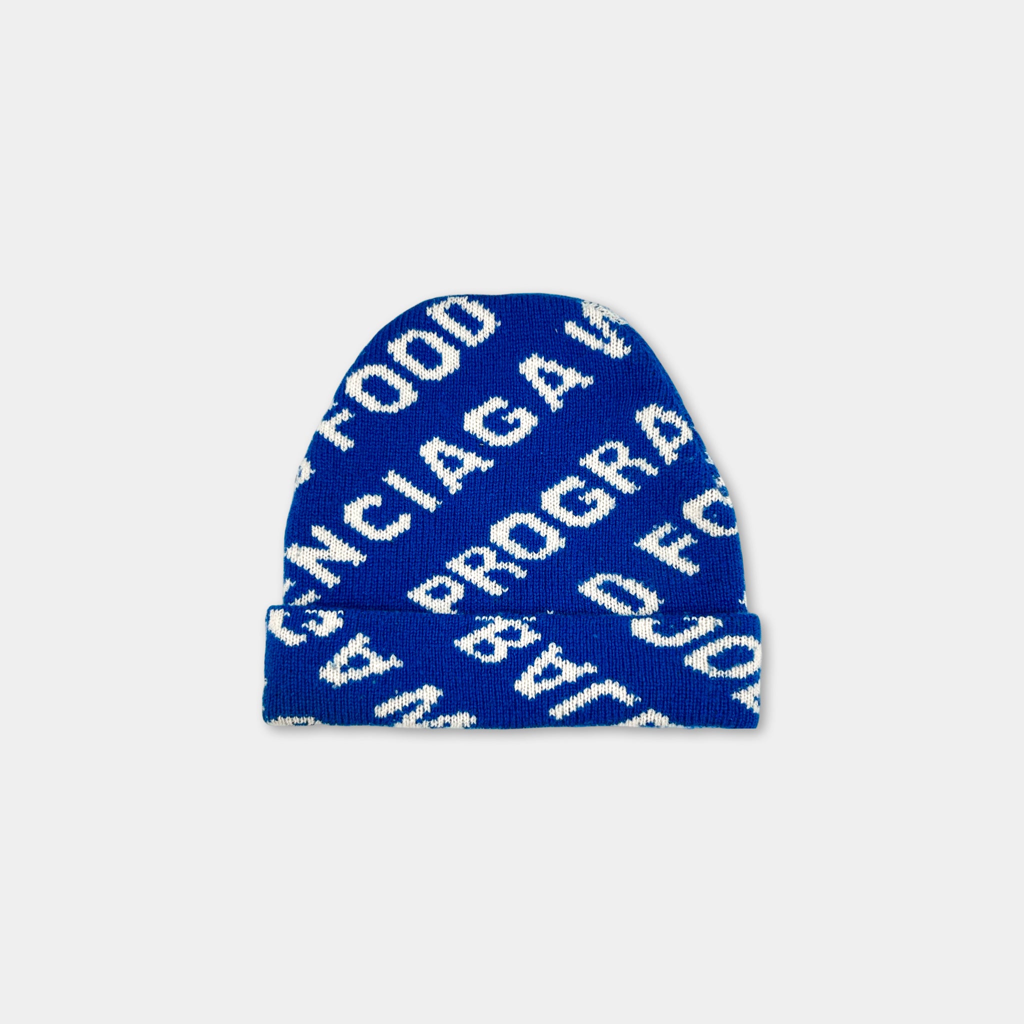 A blue knit beanie with white text on it.