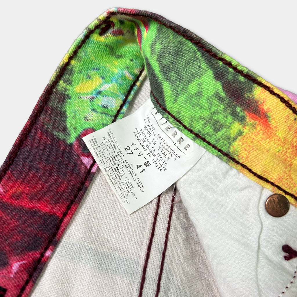 a colorful fabric with a printed pattern, and there is a label attached to it.