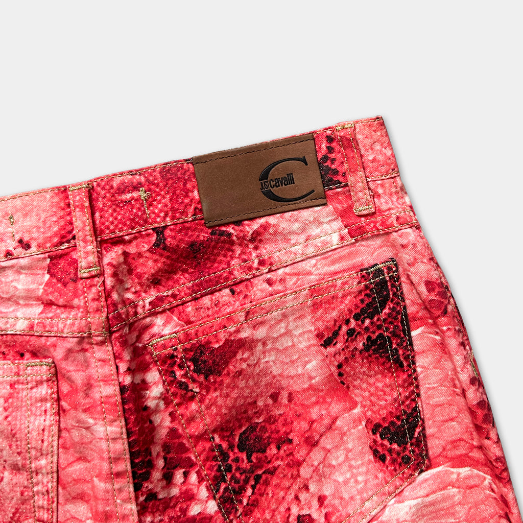 A pair of red pants with a distinctive snake skin pattern.