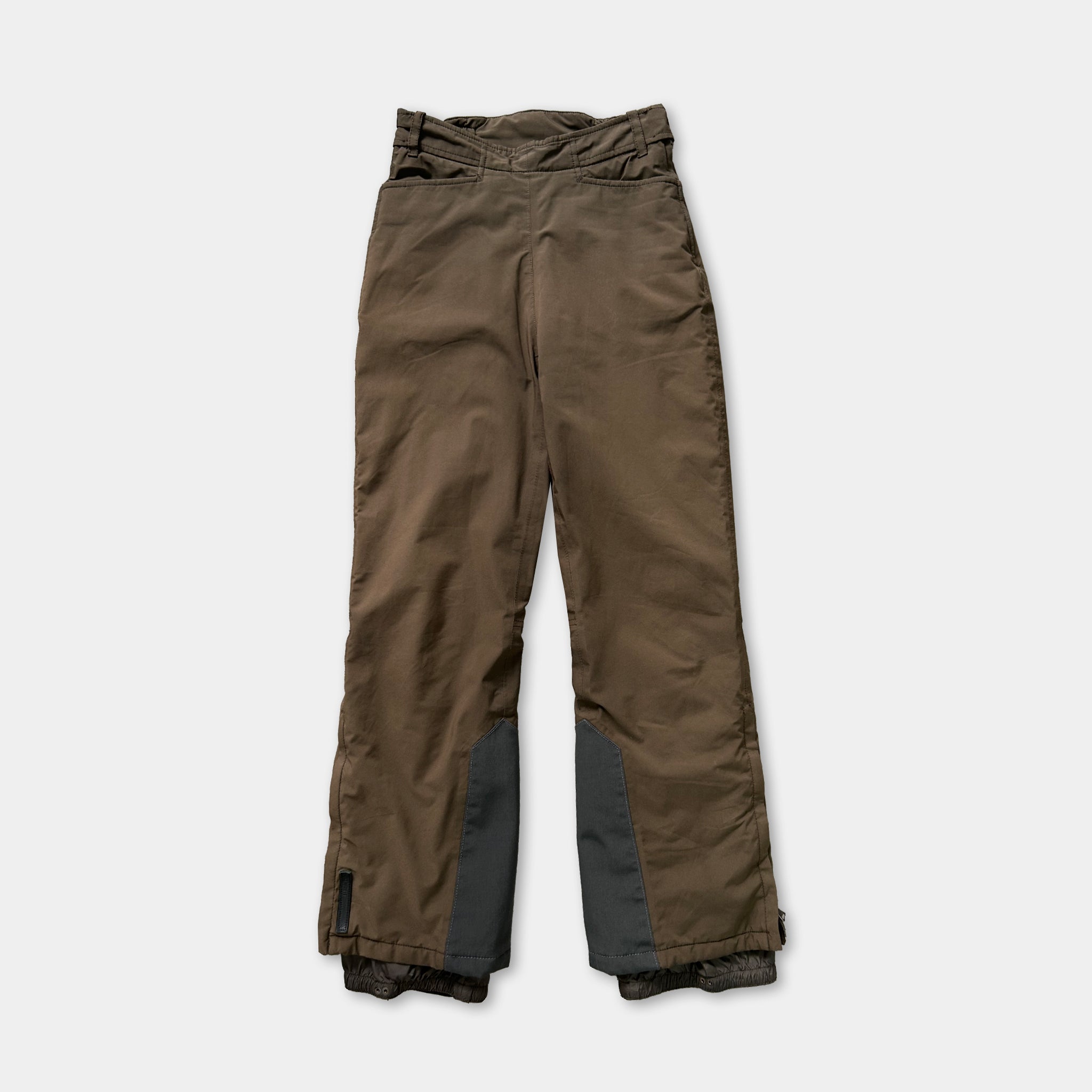 A pair of brown ski pants with a gray lining, displayed against a white background.