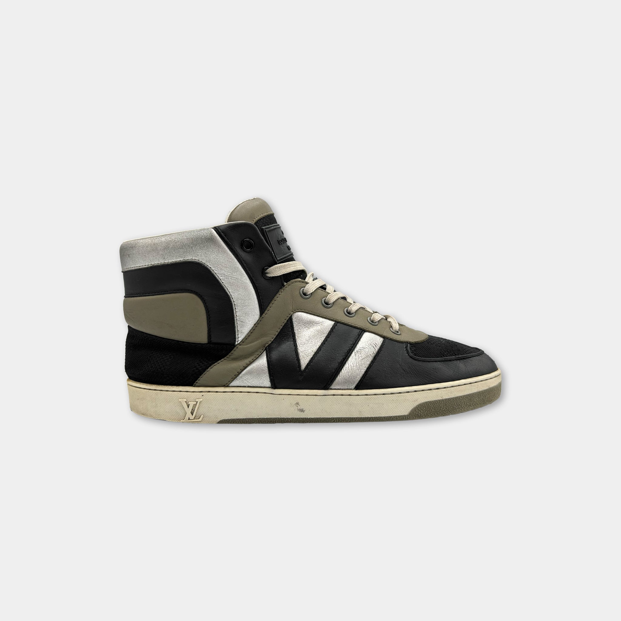 A black and gray high-top sneaker with a white sole and laces.