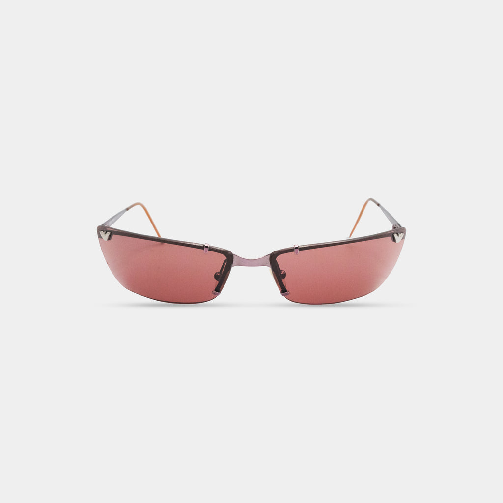 A pair of red-tinted sunglasses with a sleek, modern design.
